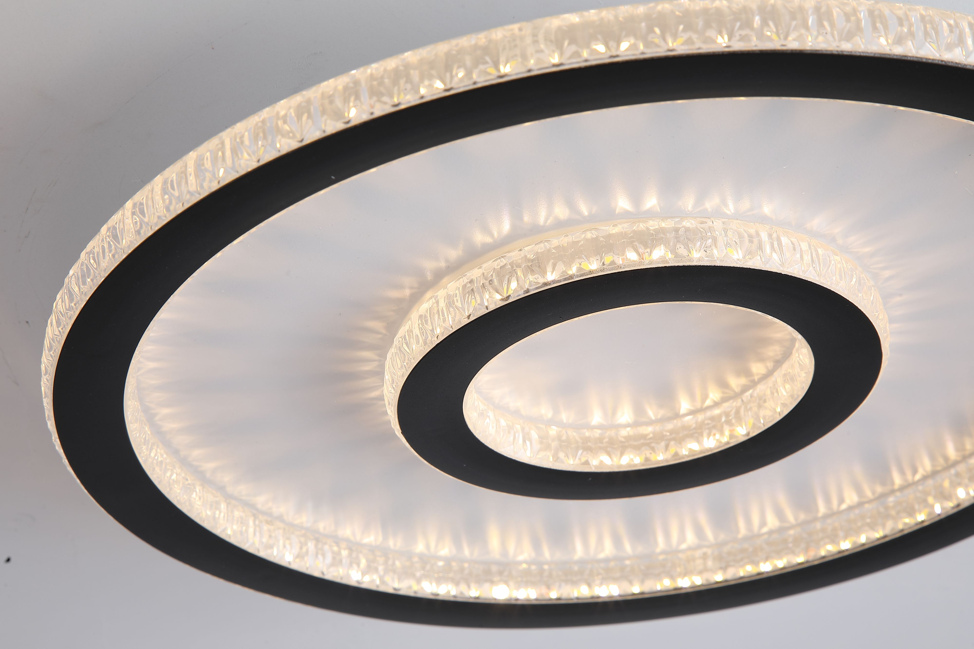 Close up of the Searchlight Roundel LED flush light showing the faceted, crystal cut texture of the concentric acrylic rings