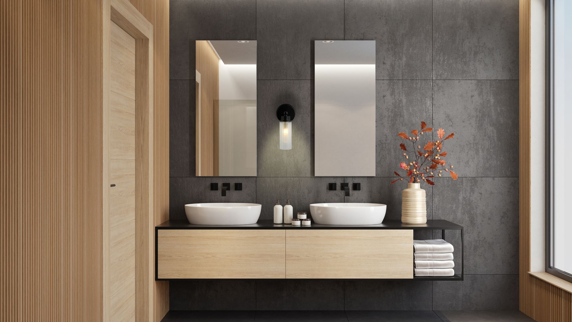 Searchlight Imperial 1 light wall light in matt black mounted between two mirrors above a double vanity in a dark stone bathroom