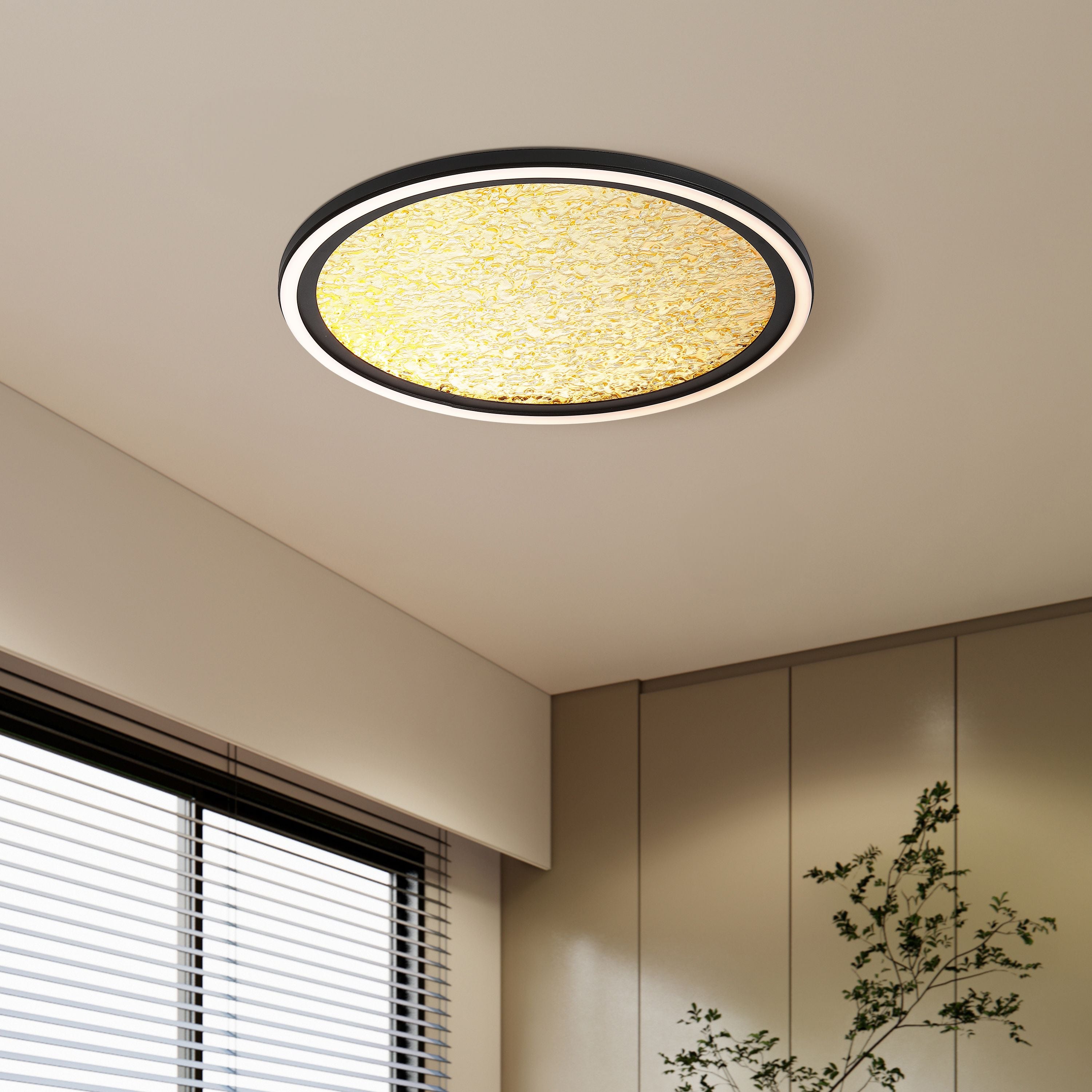 Searchlight Luna LED flush ceiling light fitted to a bedroom ceiling above a window with striped blinds and a potted plant