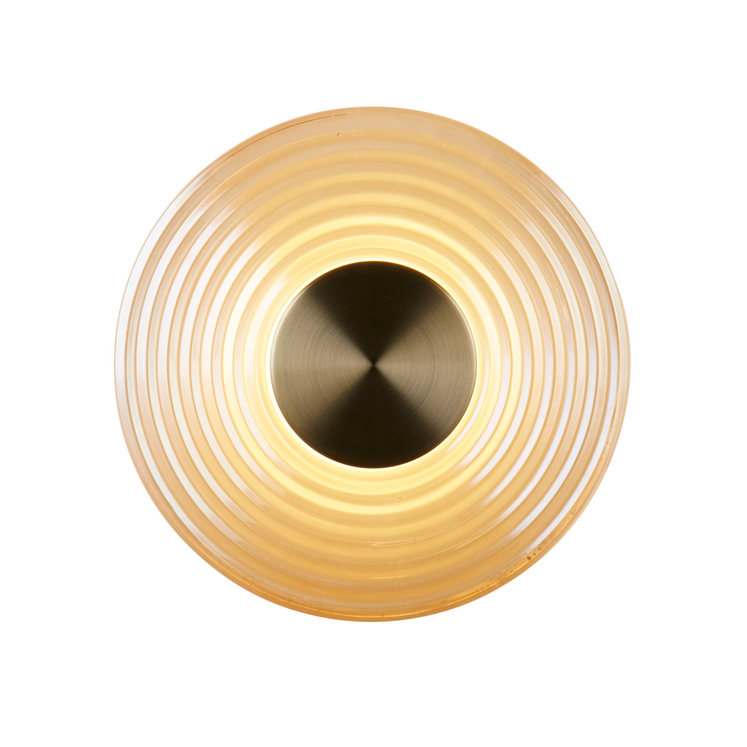 Searchlight Cleo LED wall light in antique brass and amber glass, front on view showing the ribbed record inspired rings lit from behind