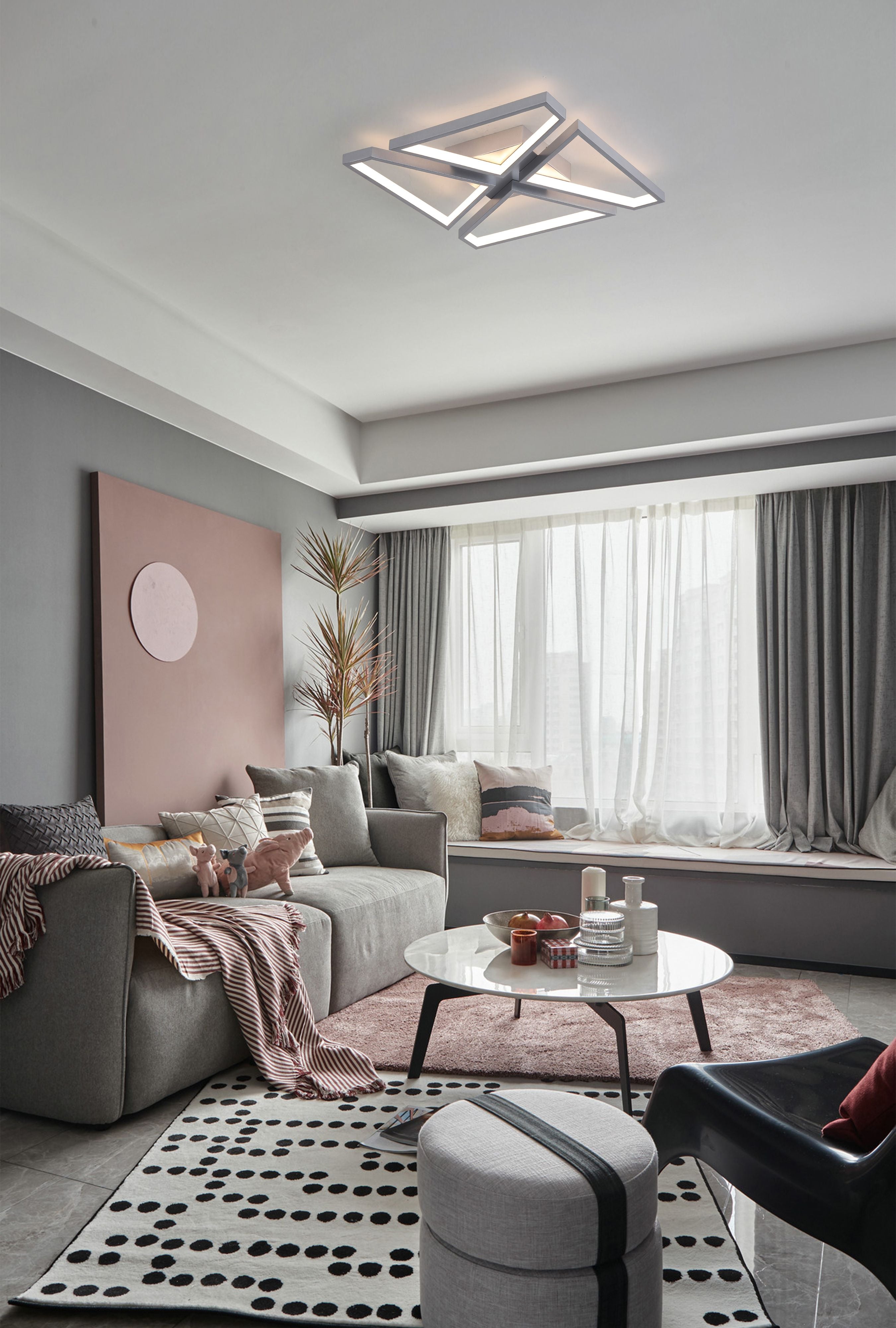 Searchlight Quatro LED Flush ceiling light in satin silver, styled on the ceiling of a modern living room with a pink accent wall and striped furniture