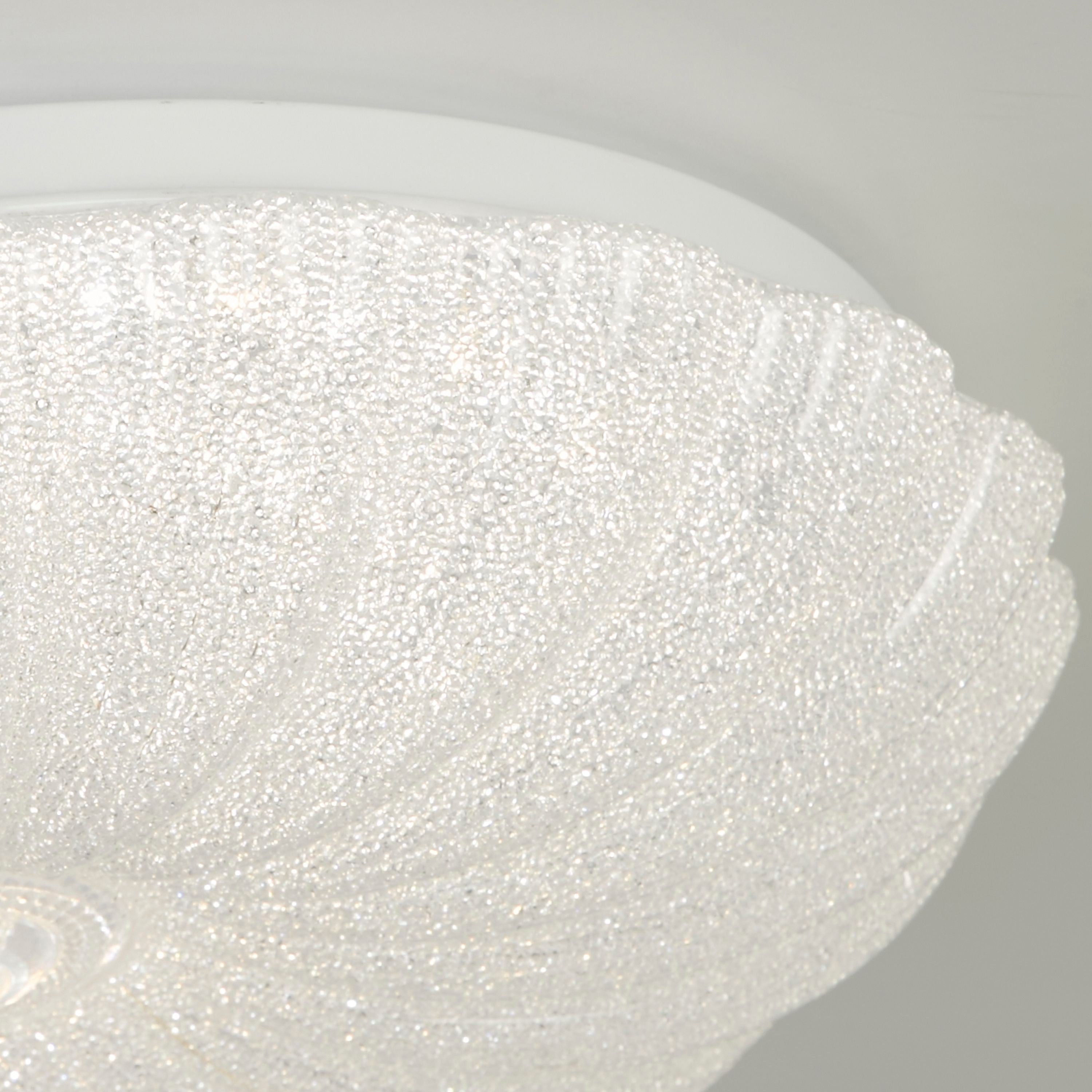 Close up of the Searchlight Pandora's crystallised acrylic texture, showing the sparkling crystal sand finish