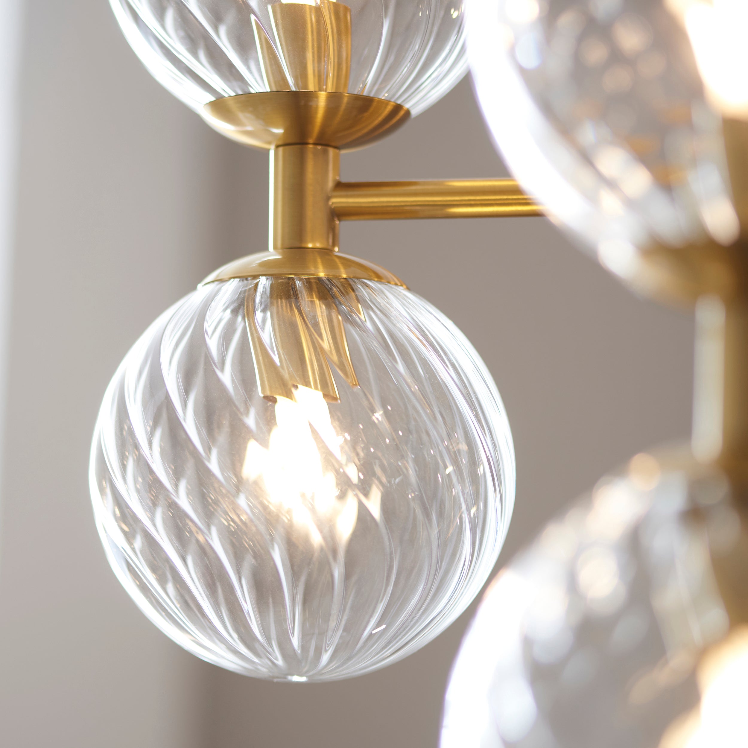 Utopia Atomic 12 Light Pendant - Brushed Aged Brass & Twisted Clear Glass