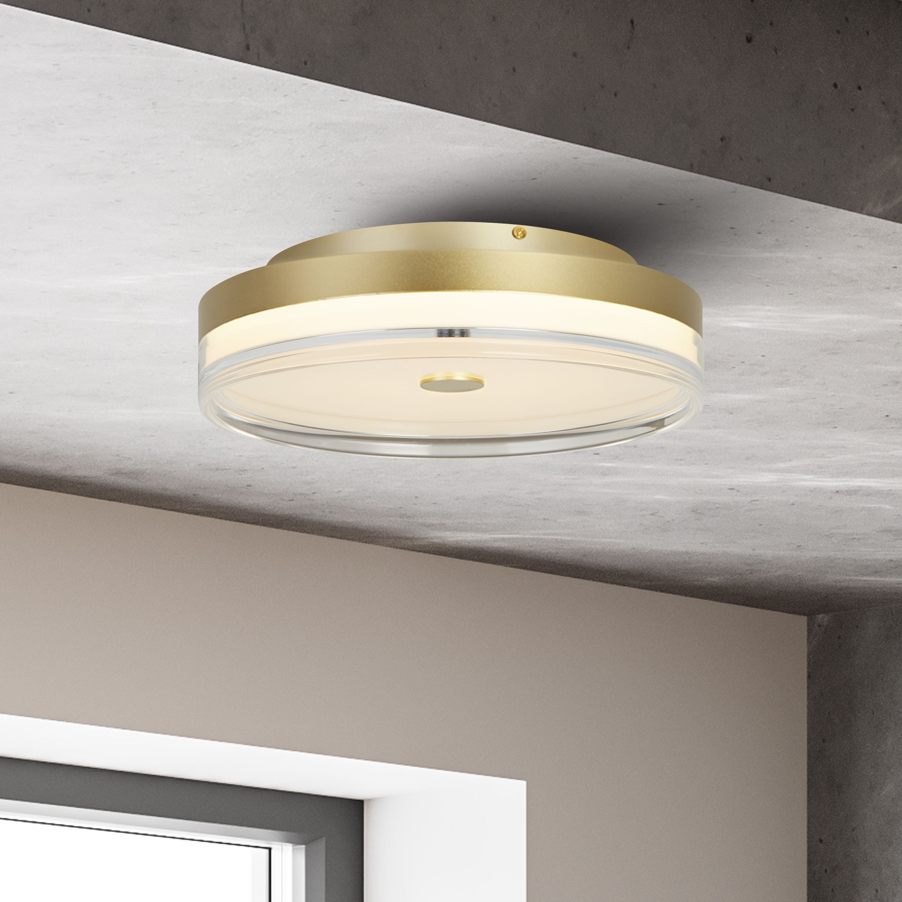 Searchlight Cyprus LED Flush 40cm in gold shown lit on a concrete ceiling above a window in a minimalist styled interior