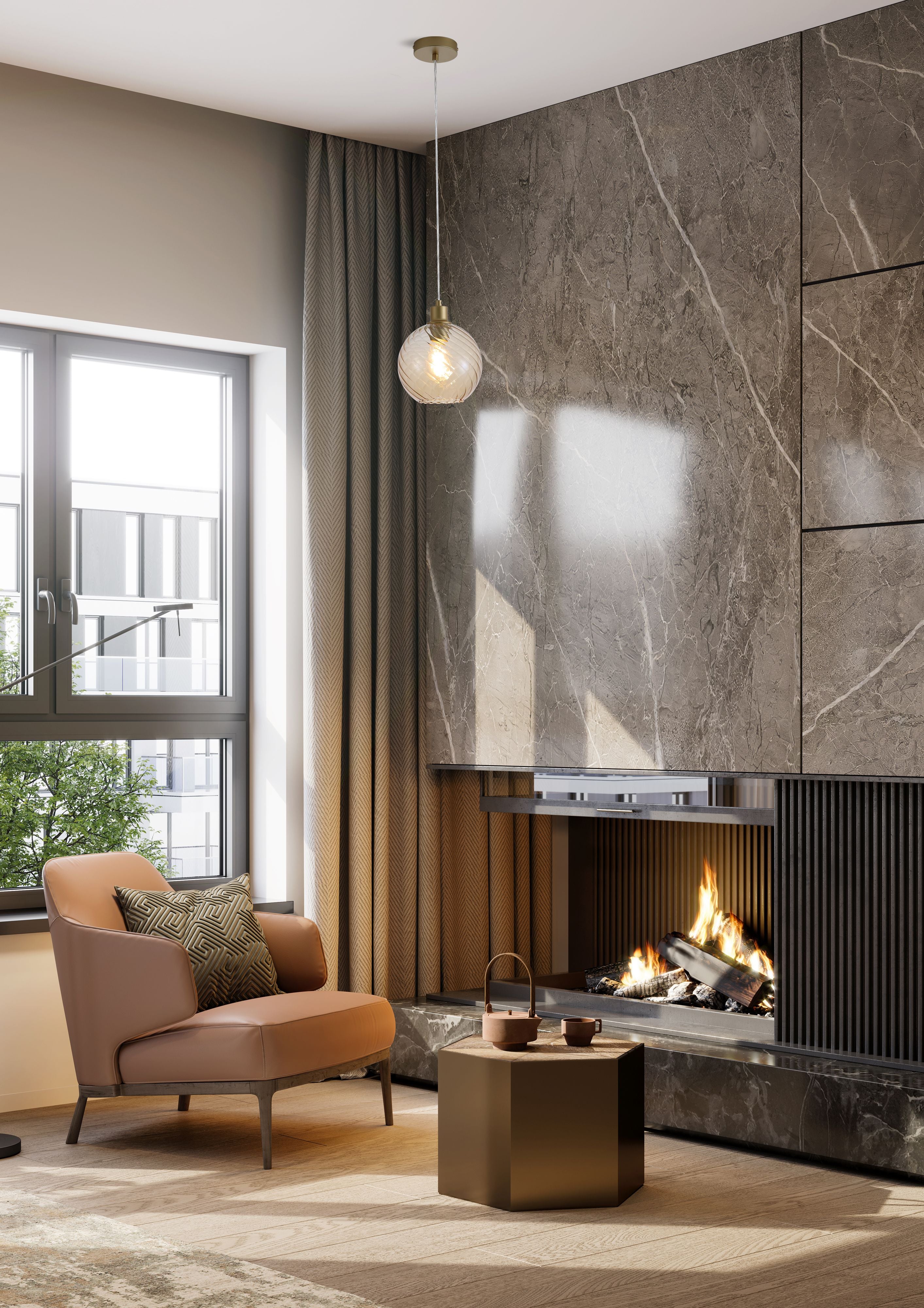 Radiance 1 Light Pendant styled in a living room, hanging beside a marble fireplace wall with a tan leather armchair