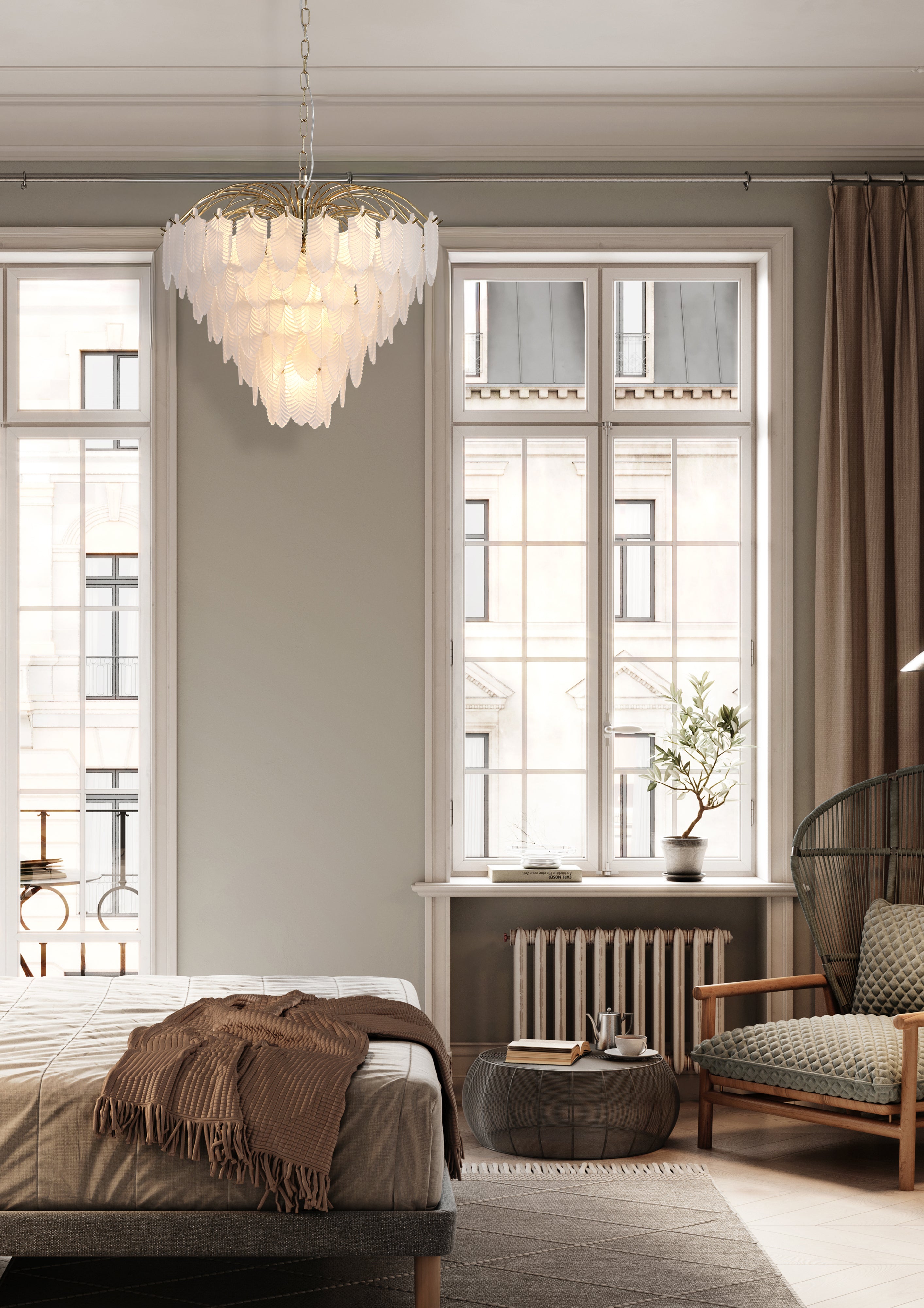 Searchlight Feather 6 light pendant in polished brass, hanging lit in a bedroom with tall windows and a radiator below