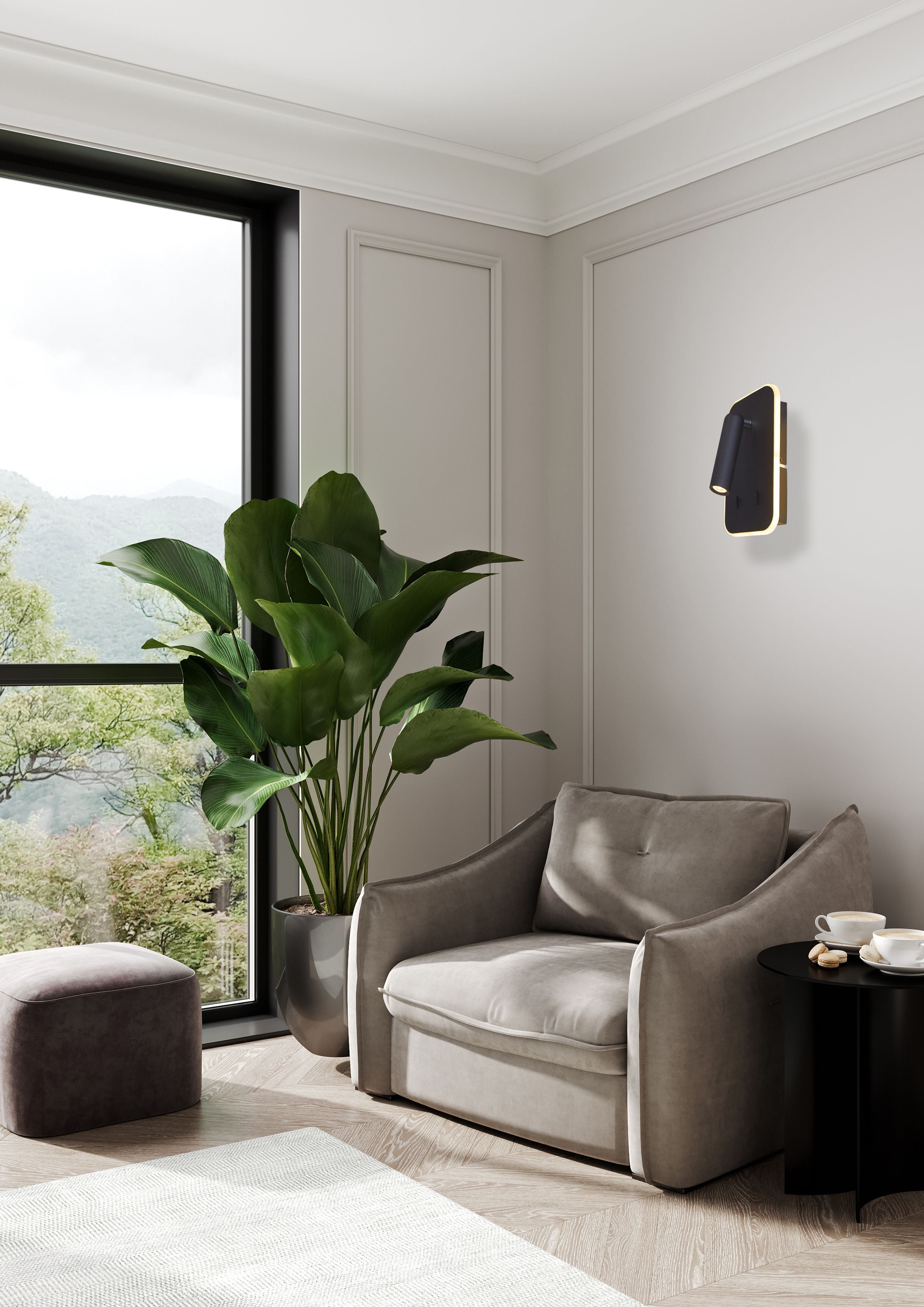 Searchlight Sonny LED Wall Light in black mounted above an armchair in a living room corner styled with a large potted plant