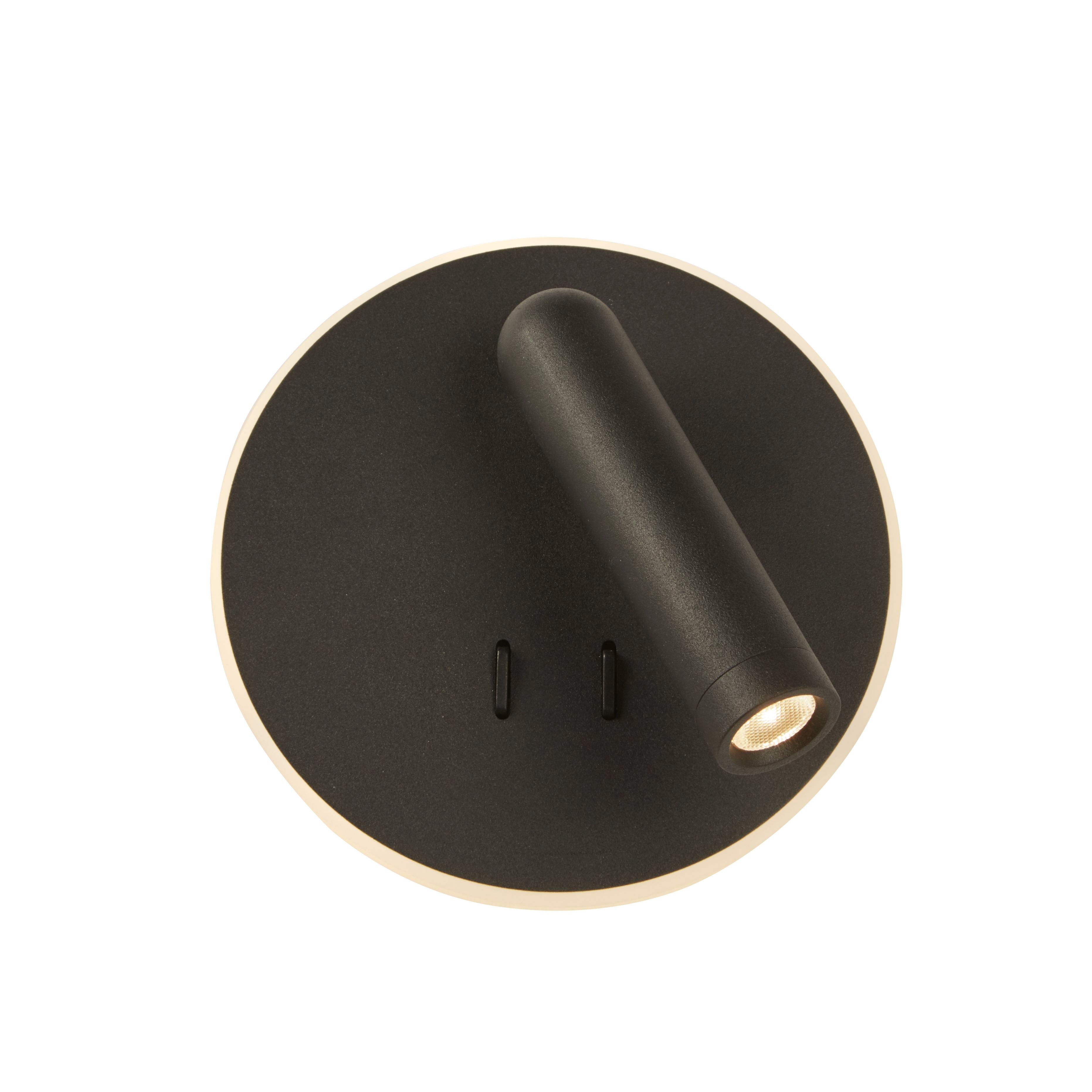 Front view of the Cher LED wall light in black, showing the angled spotlight head and the soft ambient light ring glowing at the base of the disc