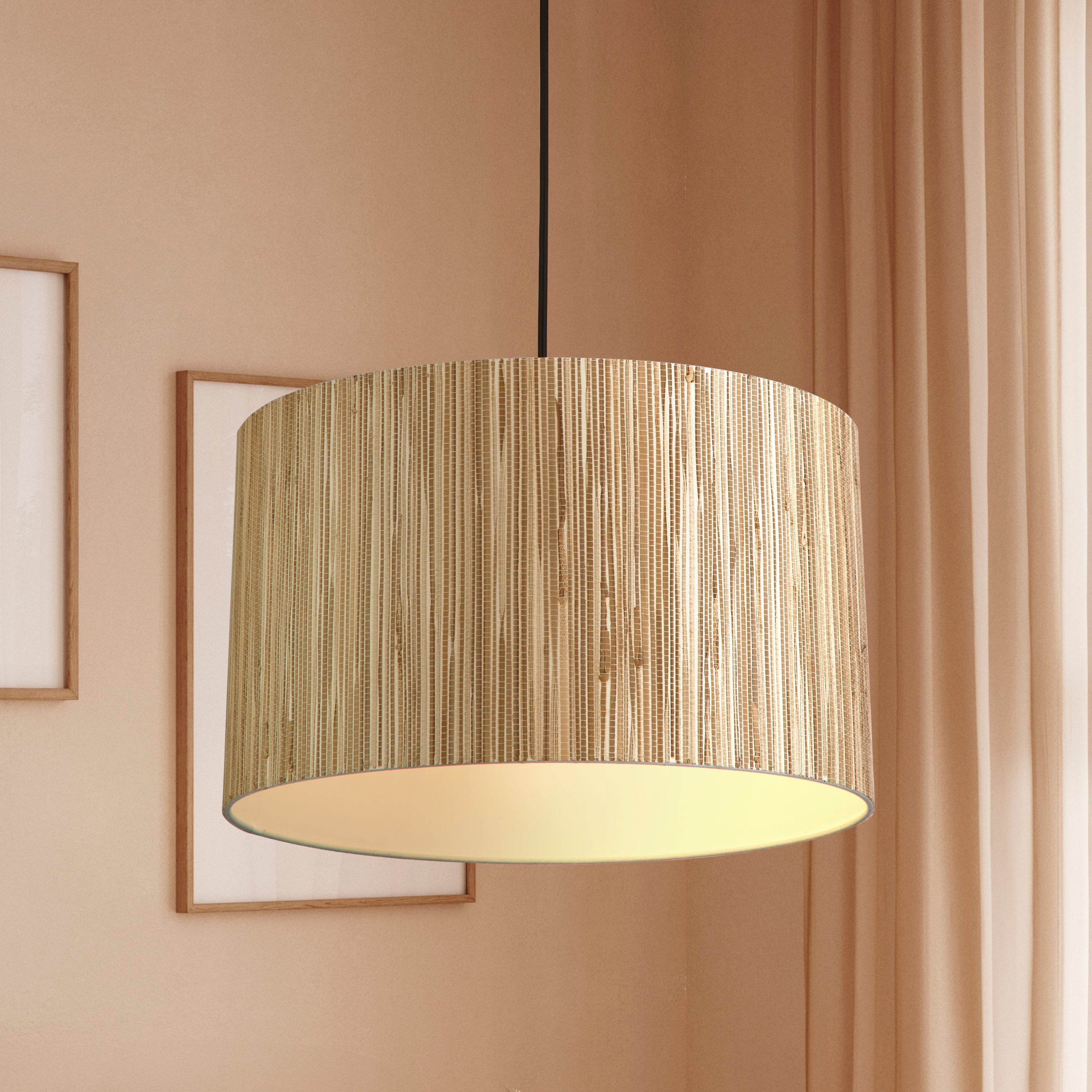 Searchlight Meadow pendant light styled in a terracotta pink room beside framed art and a curtain