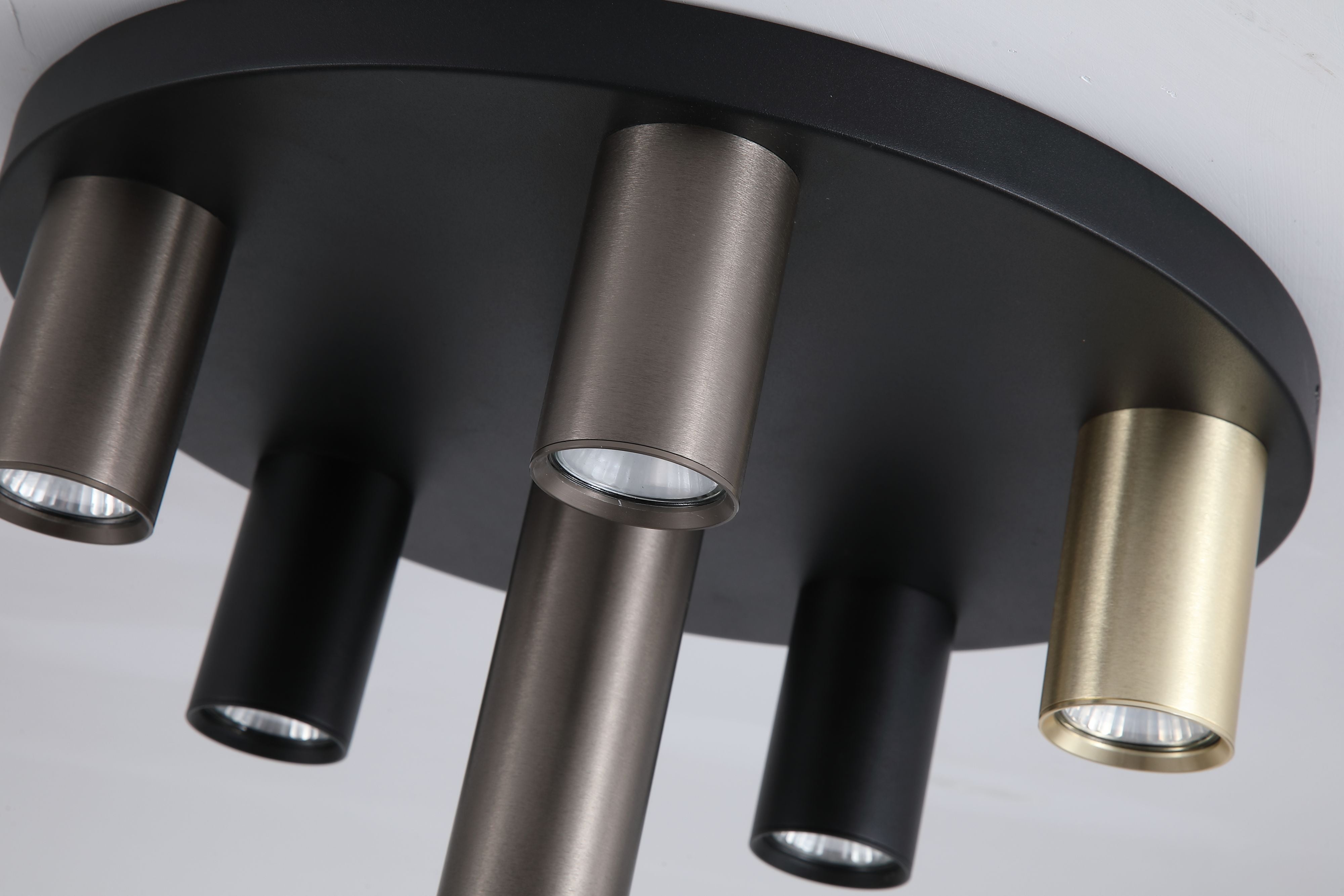 Close up from below of the Searchlight Tubes 6 Light Flush 40cm, showing the brushed metal texture and GU10 lamps inside each tube