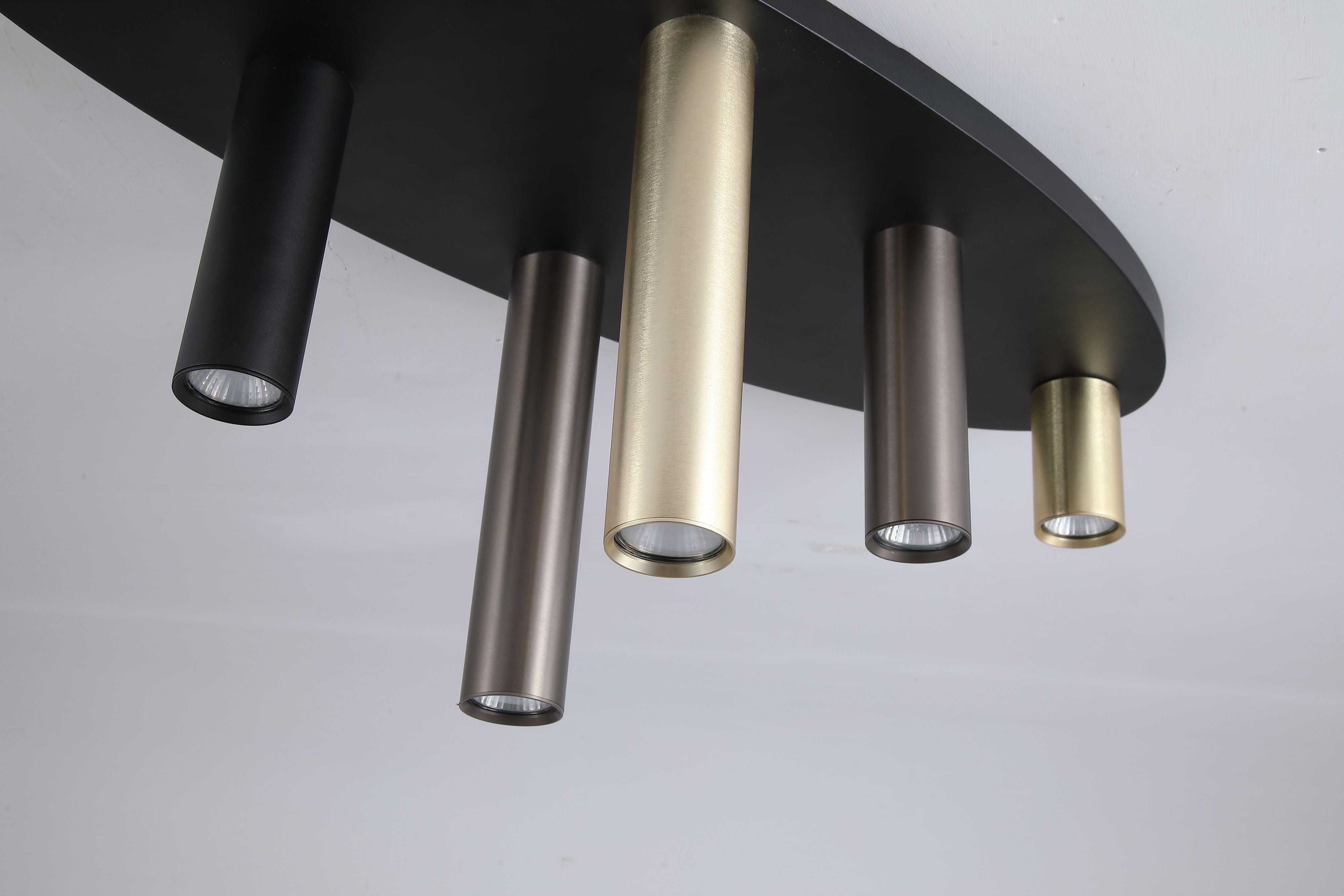 Close up from below of the Searchlight Tubes 6 Light Flush 80cm, showing the brushed metal texture and GU10 lamps inside each tube
