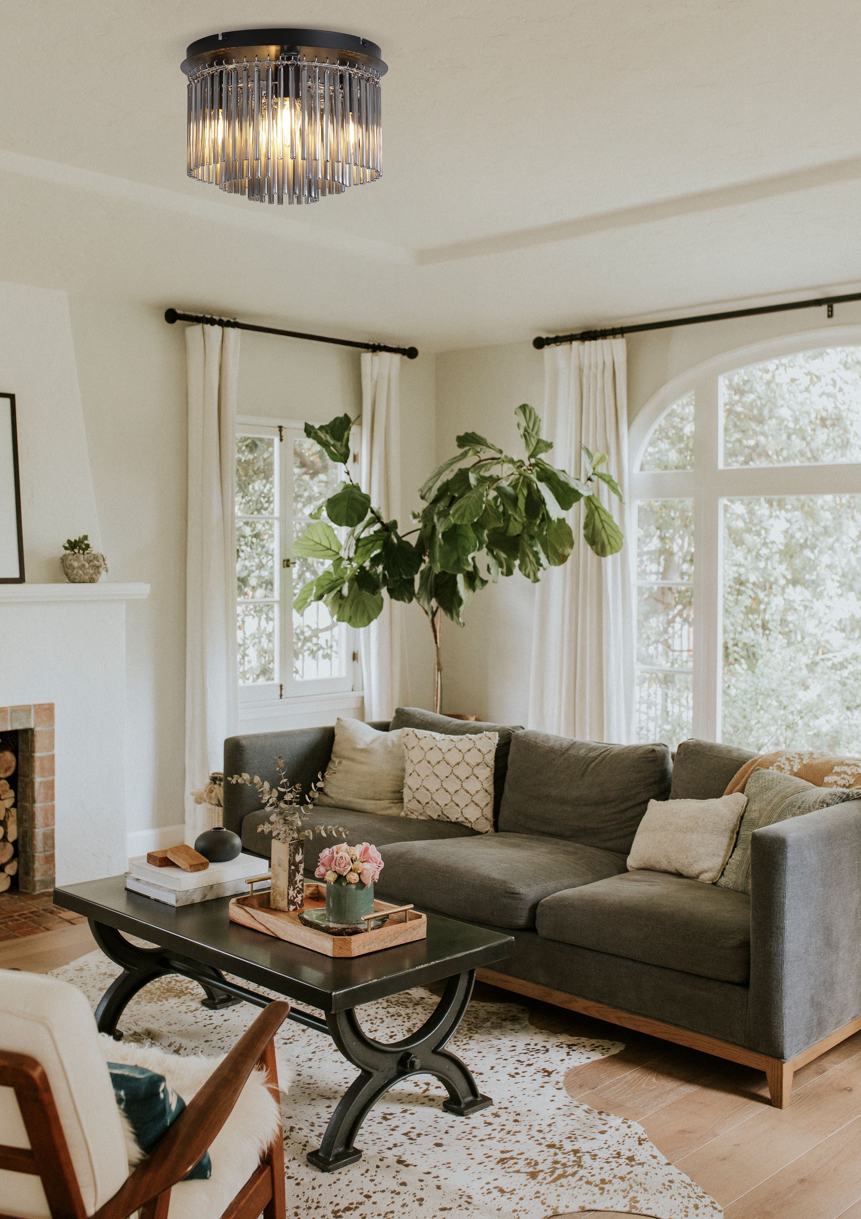 Searchlight Swizzle 5 Light Flush fitted to a white ceiling in a living room with a brick fireplace and grey sofa