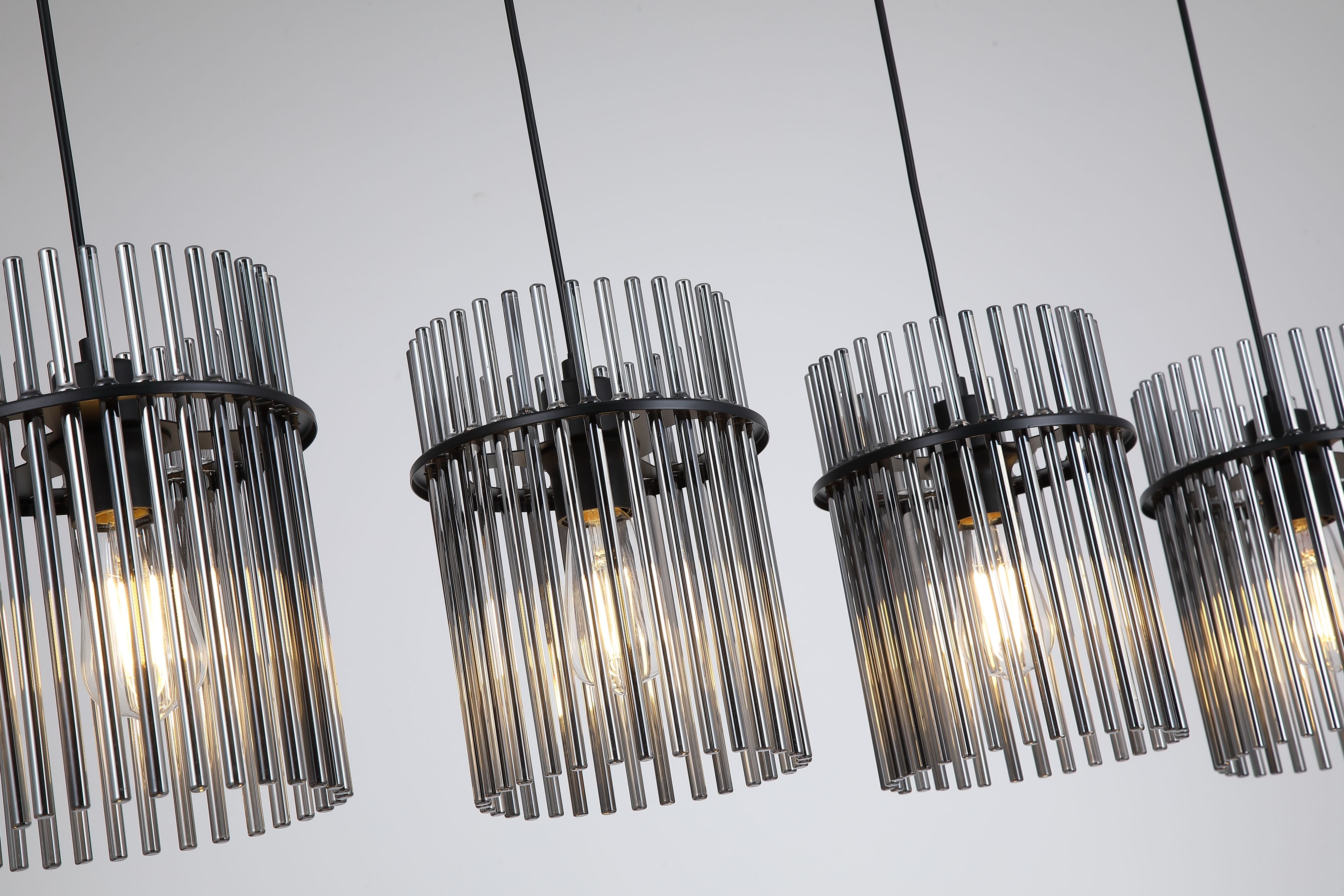 Close up of four lit Searchlight Swizzle Bar Pendant shades showing the smoked glass rods and GLS bulbs