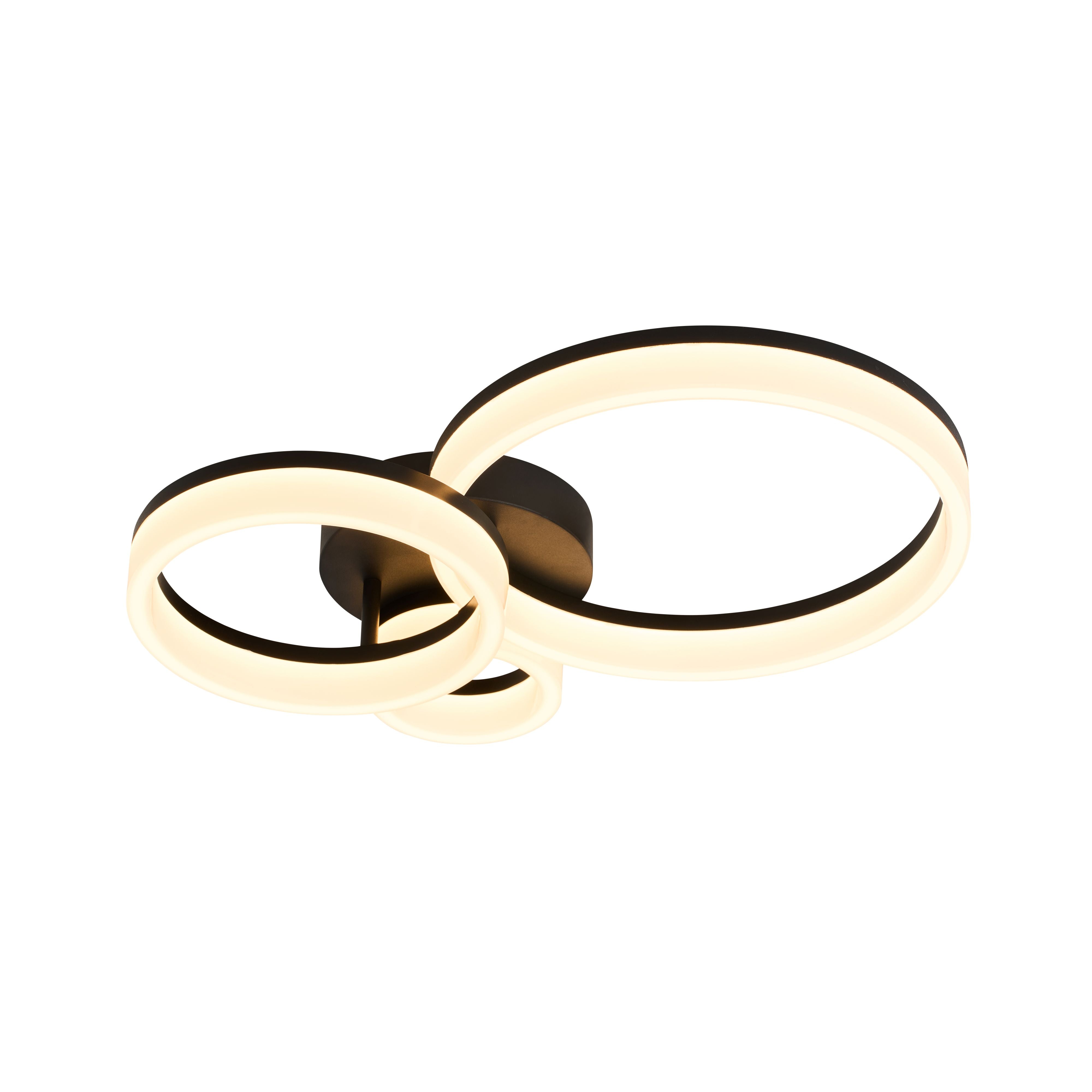 Searchlight Triple LED Flush ceiling light in matt black, switched on showing three overlapping rings glowing warm white against a plain white background