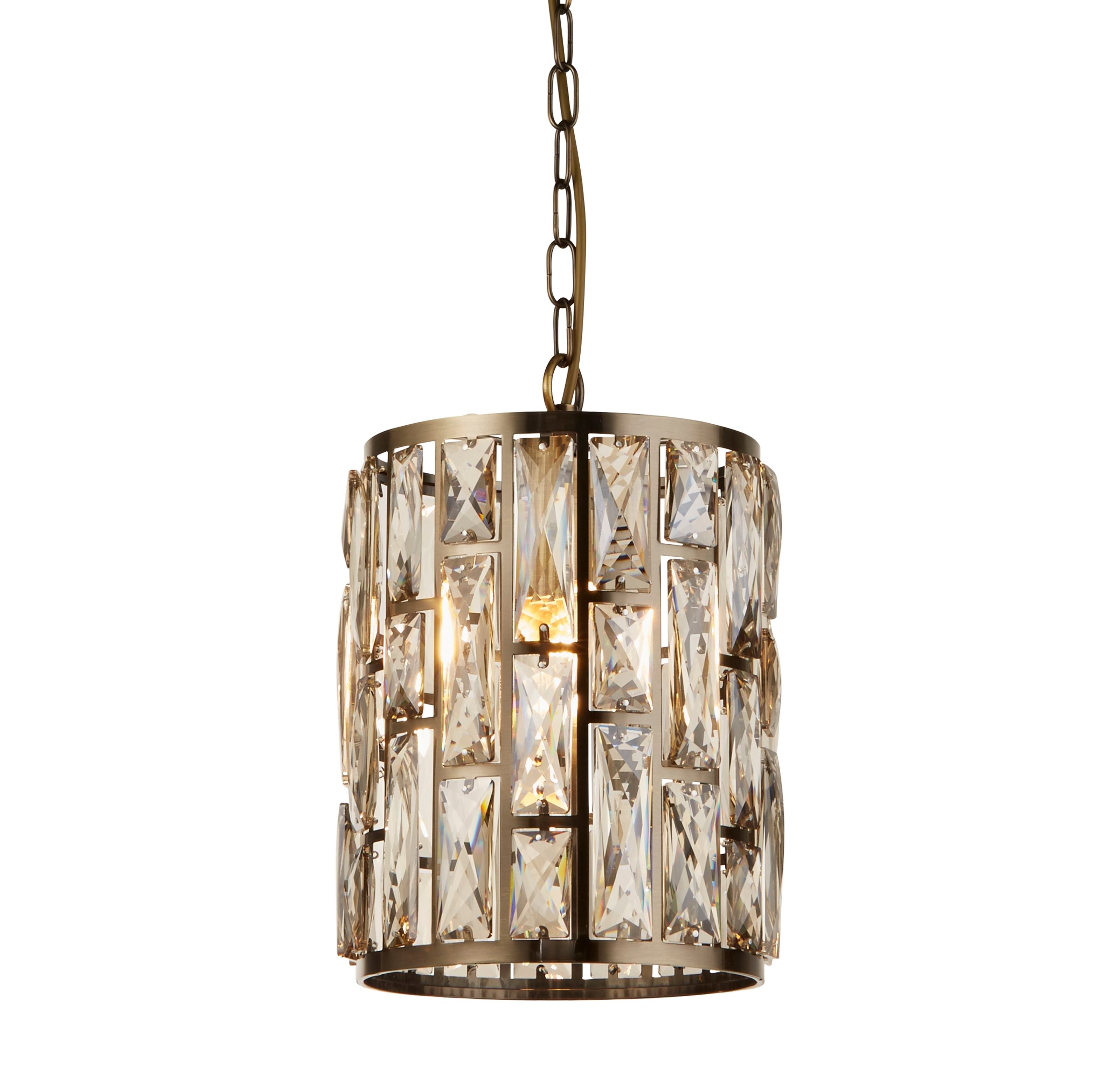 Searchlight Bijou pendant in antique brass and champagne glass, front view on a plain studio background with the crystal shade lit from within