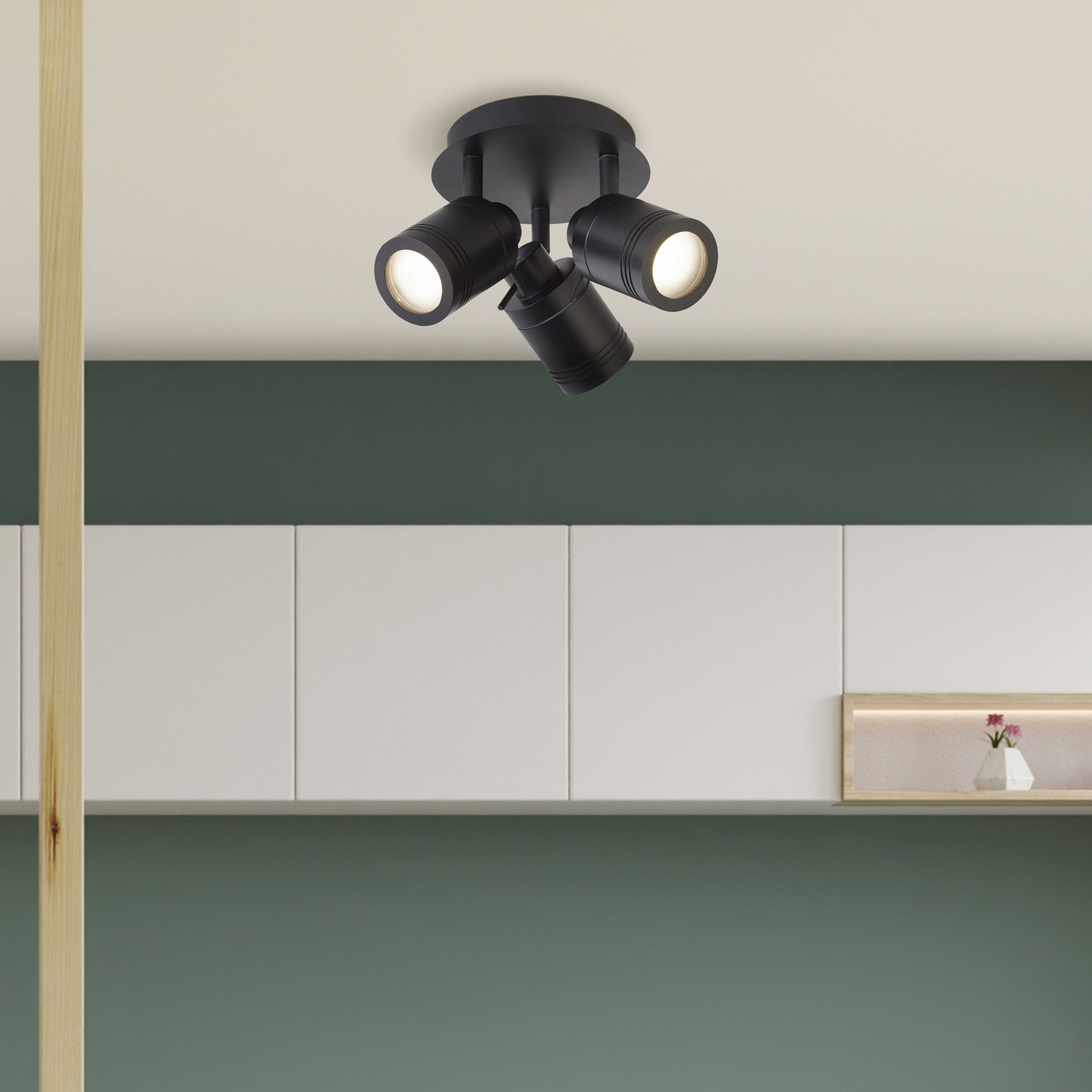 Searchlight Samson 3 light round spotlight installed on a ceiling above green and white cabinetry