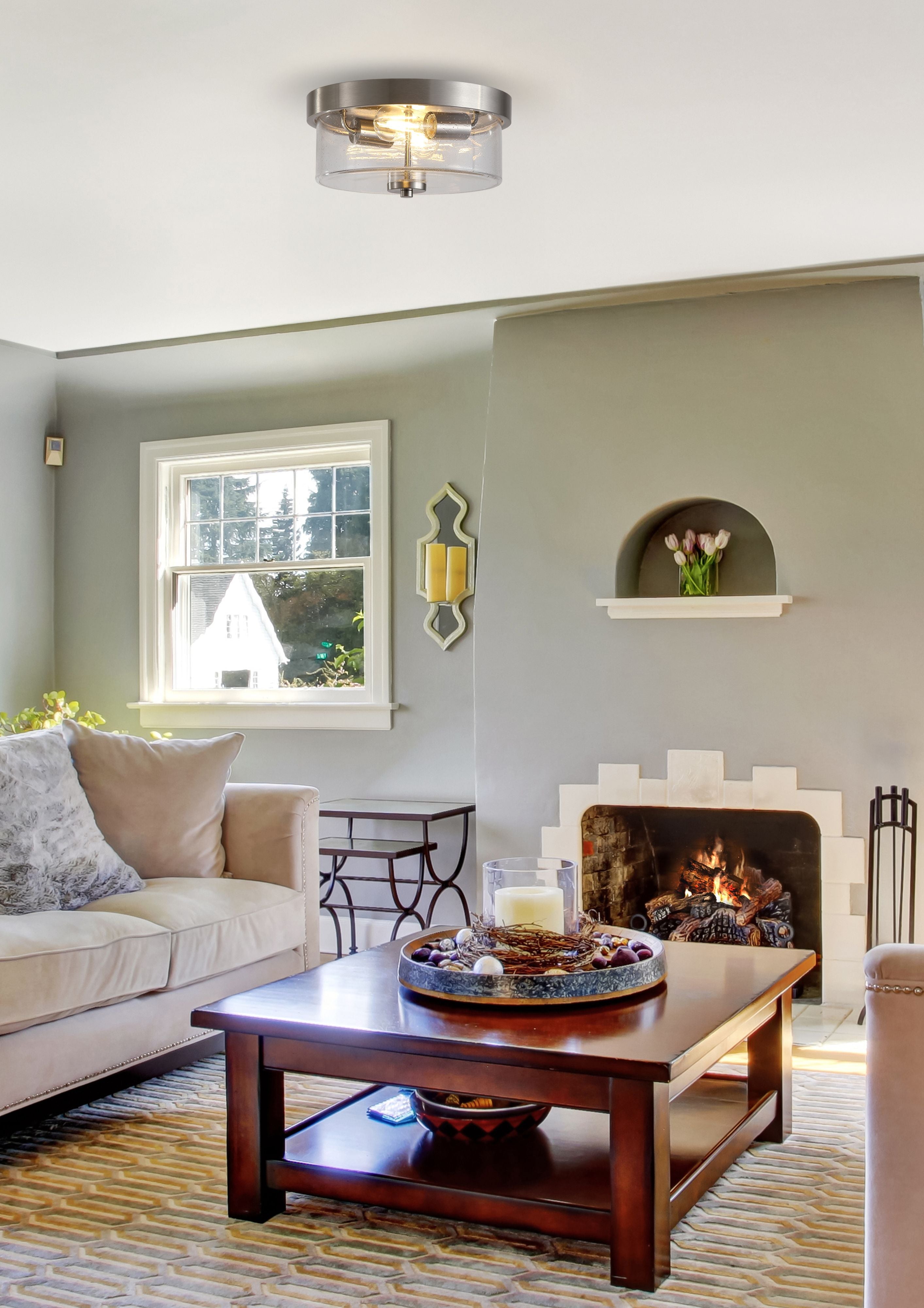 Searchlight Preston 2 light flush ceiling light in satin silver, fitted to the ceiling of a styled living room with a fireplace