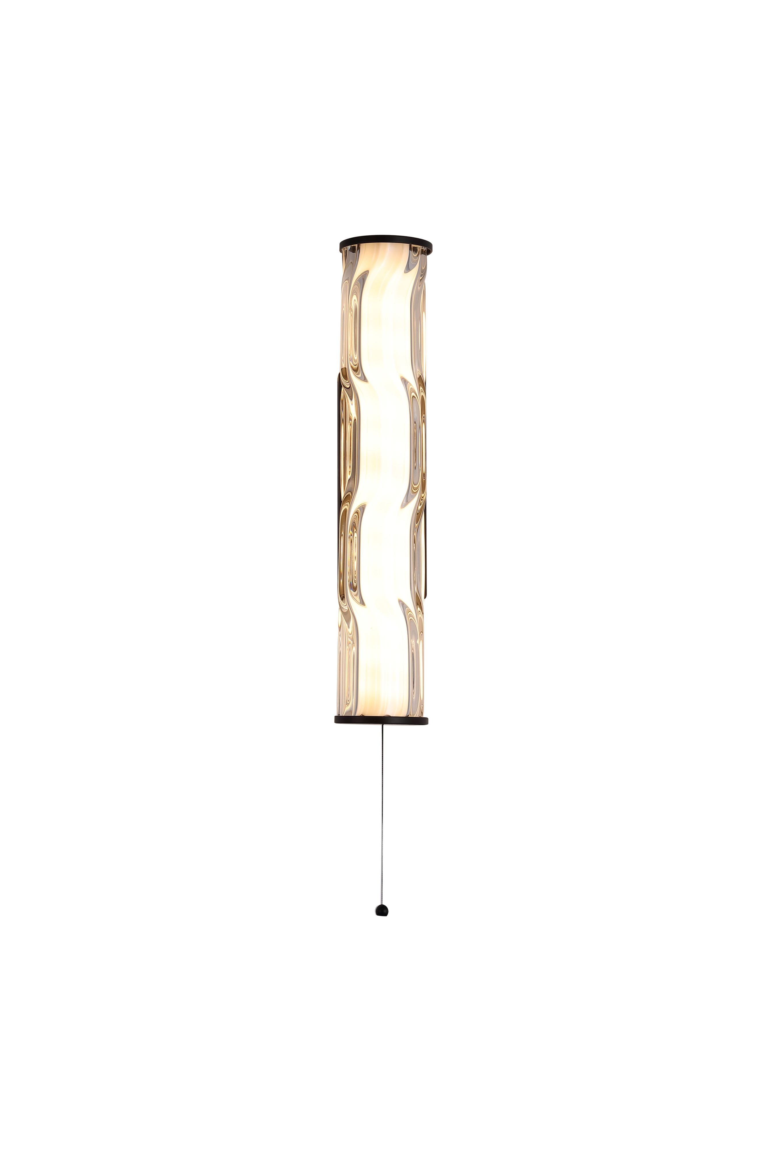 Searchlight Vibrate LED wall light with wave ridge glass diffuser and matt black frame, angled studio shot with pull cord switch visible