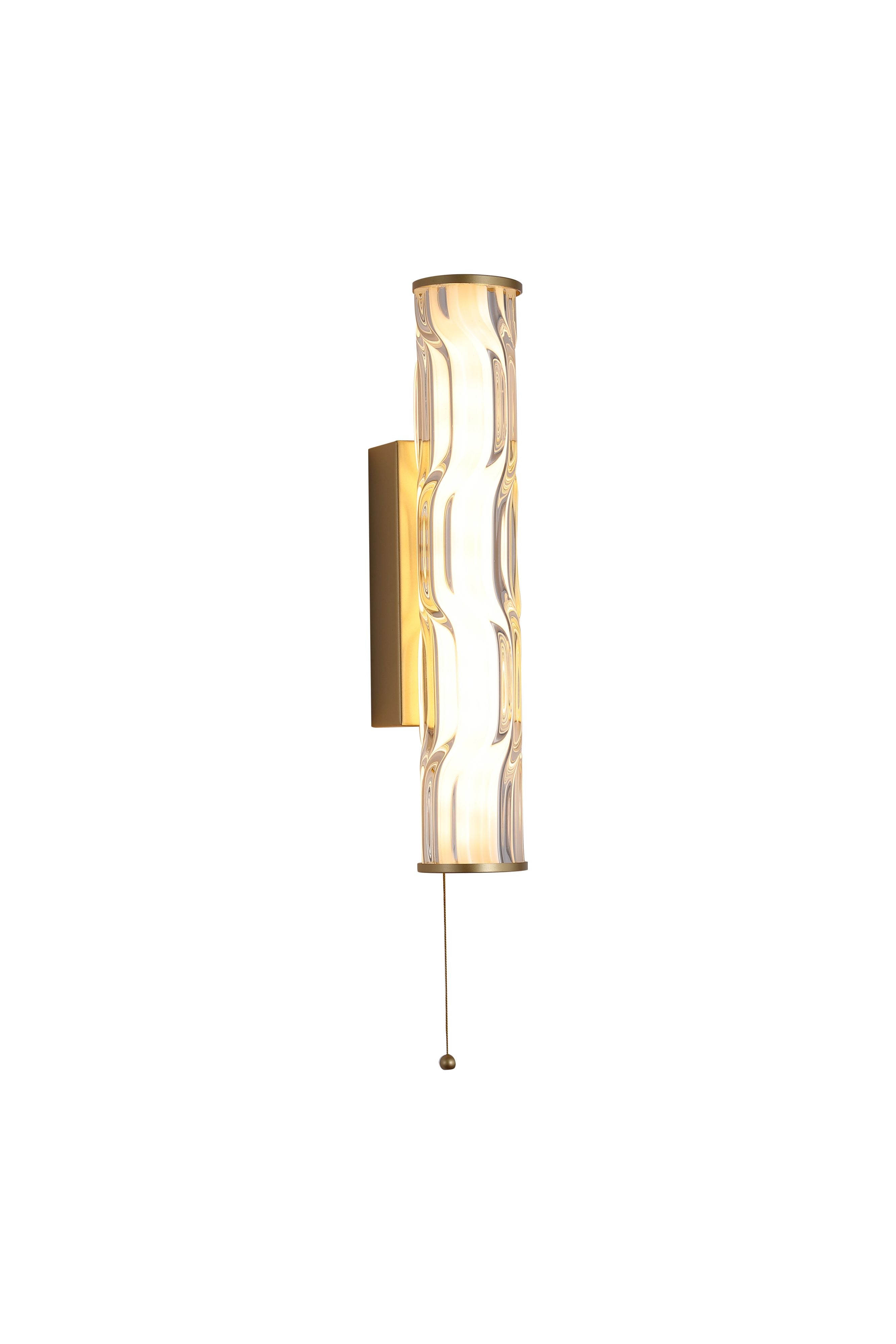 Searchlight Vibrate LED wall light in matt gold, angled studio shot of the wave ridged glass shade lit warm white with pull cord switch below