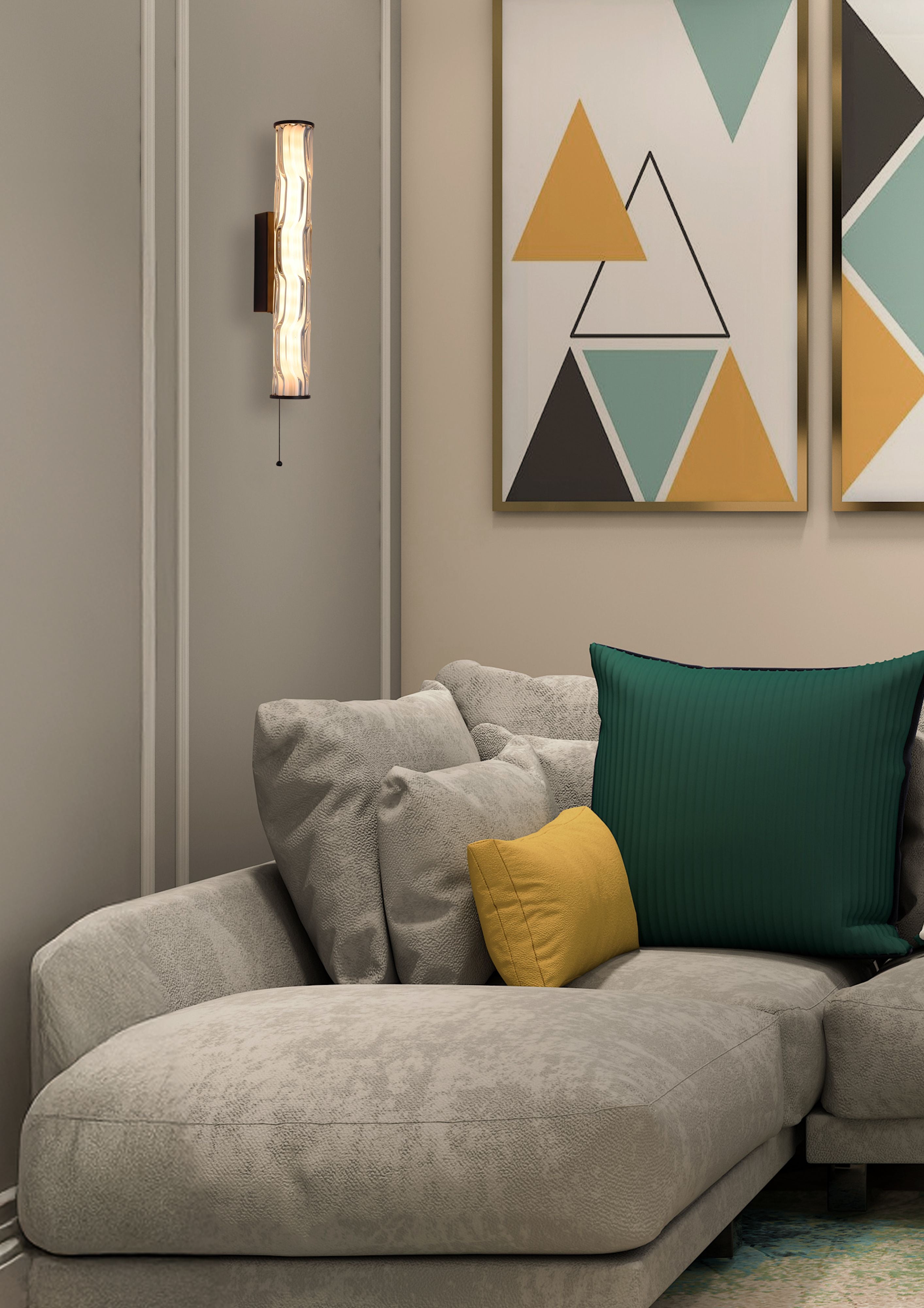 Vibrate LED wall light in matt black styled on a beige wall beside a grey sofa with cushions and geometric triangle wall art