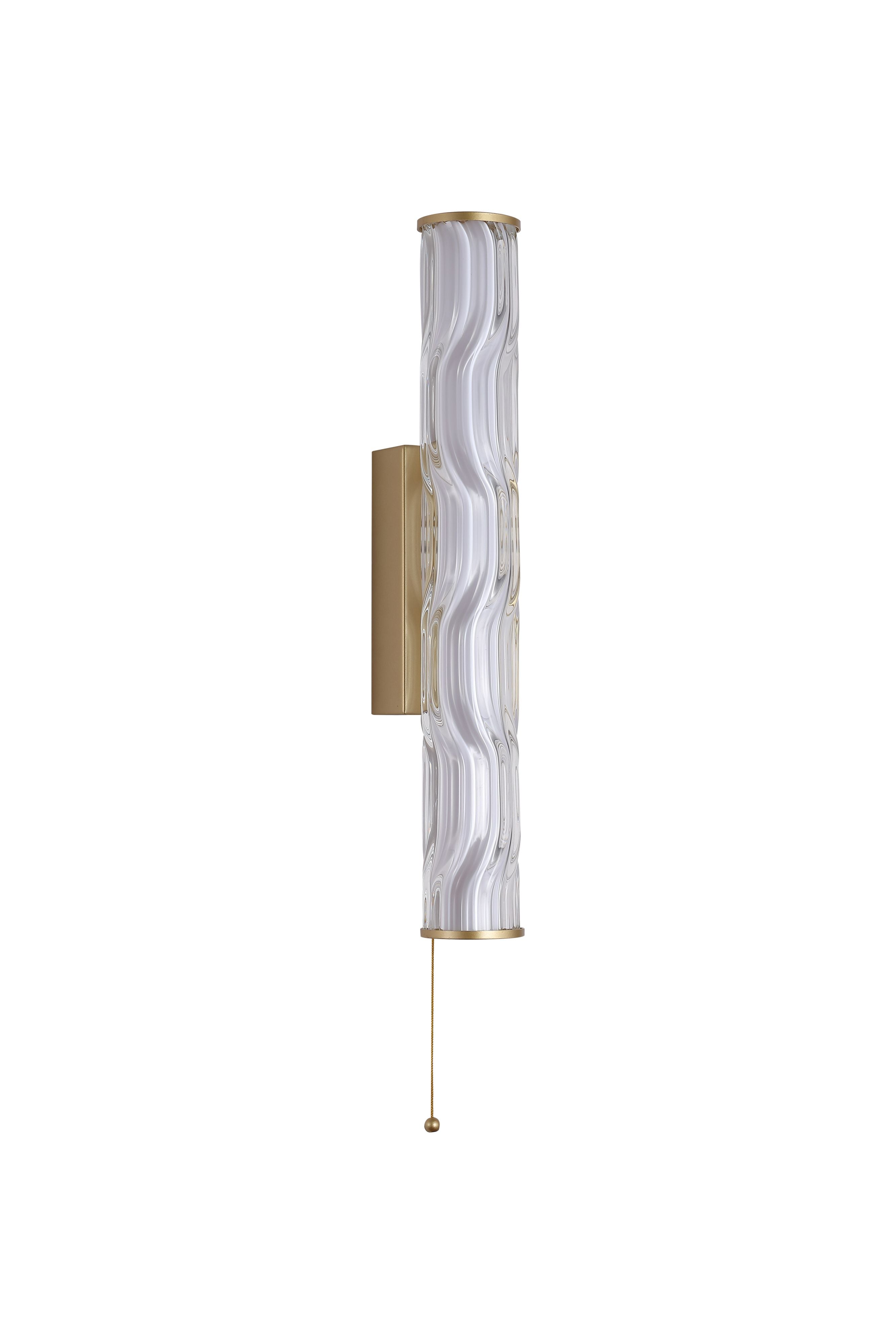 Front on studio shot of the 43cm Vibrate LED wall light in matt gold with ridged glass diffuser, pull cord and ball chain visible
