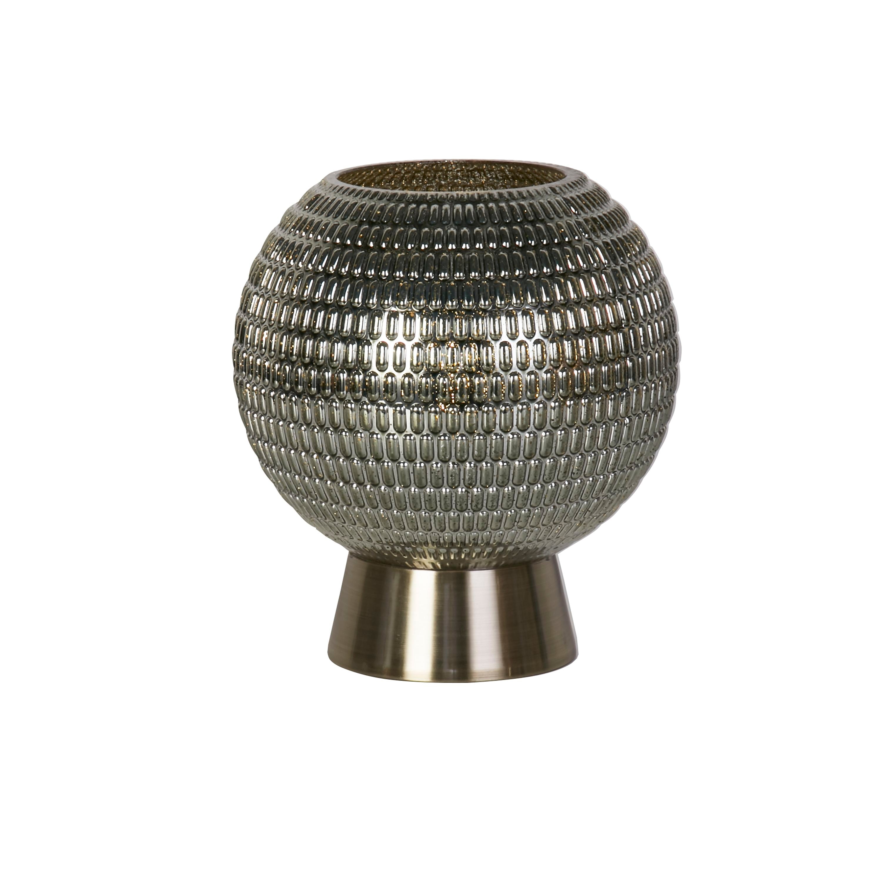 Searchlight Mila table lamp with dimpled green glass globe on a satin brass base, glowing softly, studio shot on white background