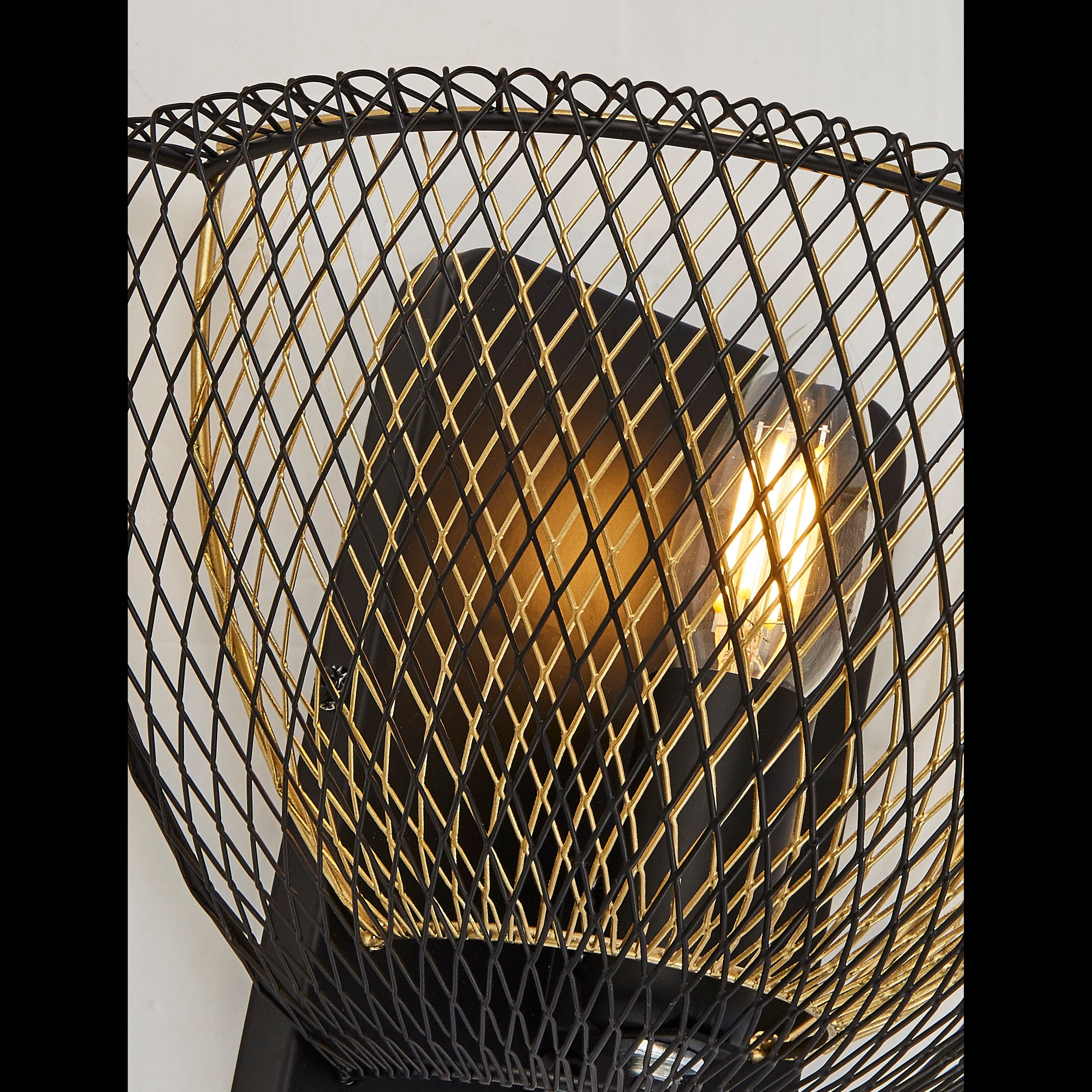 Close up of the Honeycomb wall light's black and gold mesh weave with the bulb lit inside
