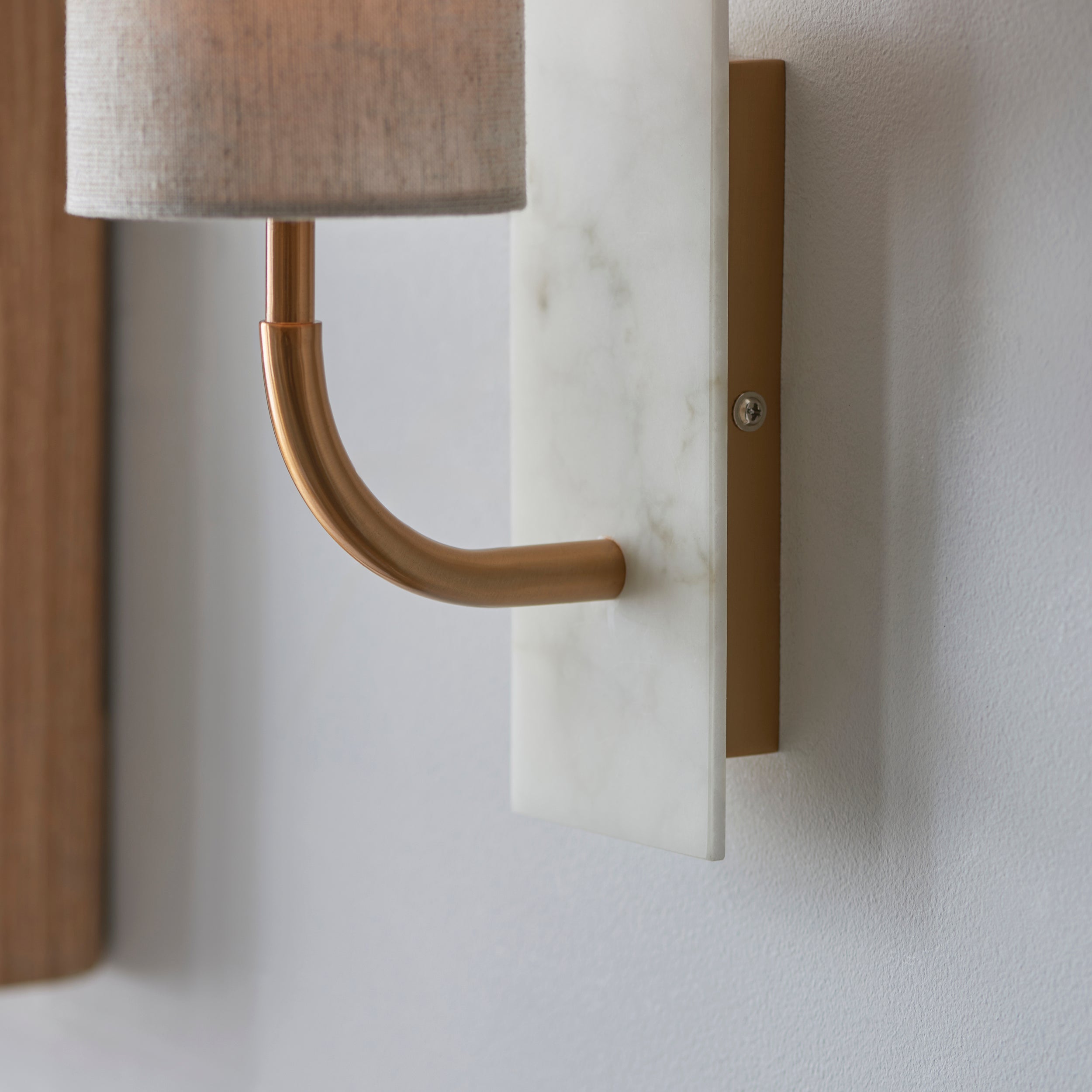 Utopia Spire Single White Marble Curved Arm Wall Light - Vintage Brass & Natural Cylindrical Shade
