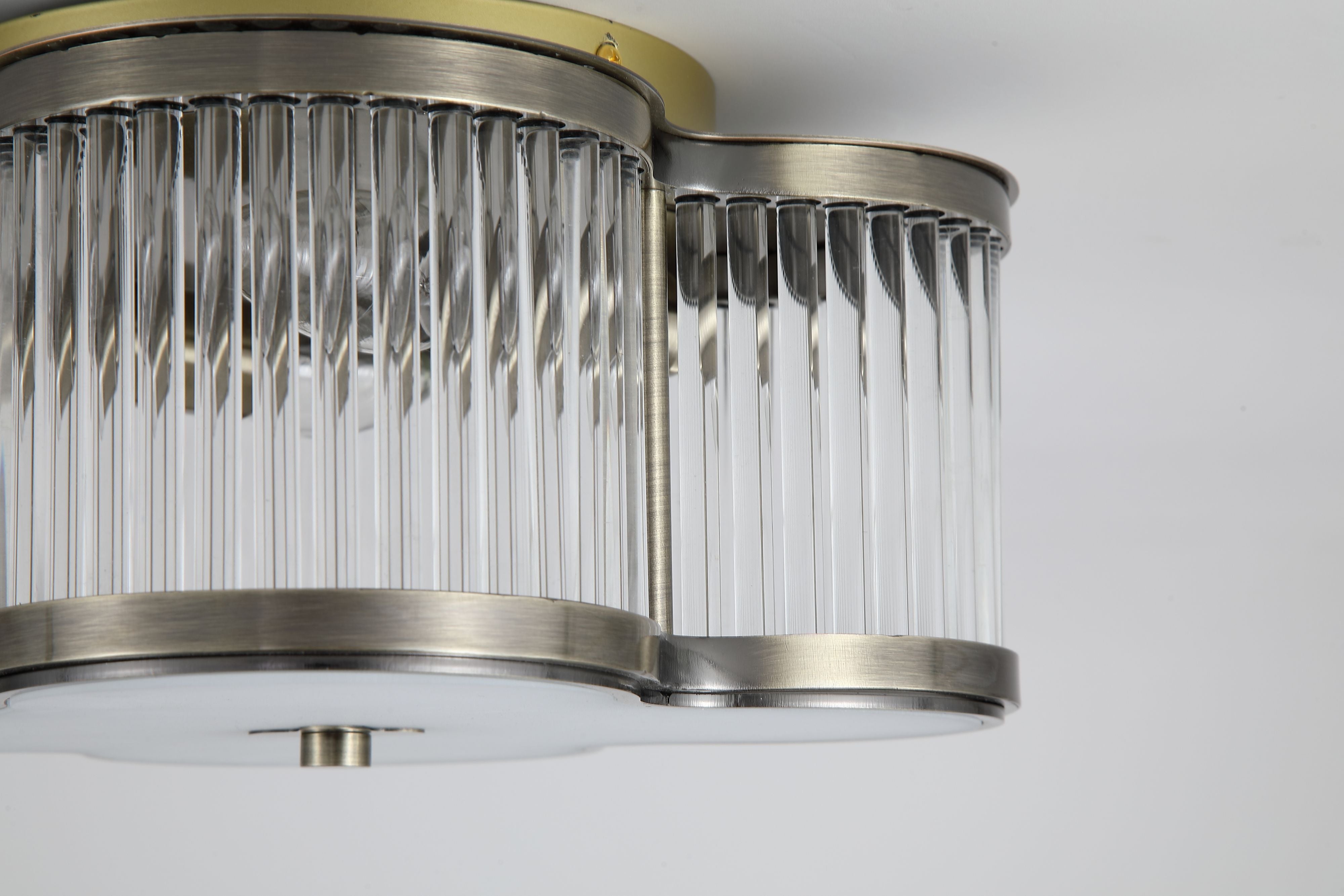 Close up of the ribbed glass rods and antique brass trim on the Searchlight Lotus 2 light flush ceiling light
