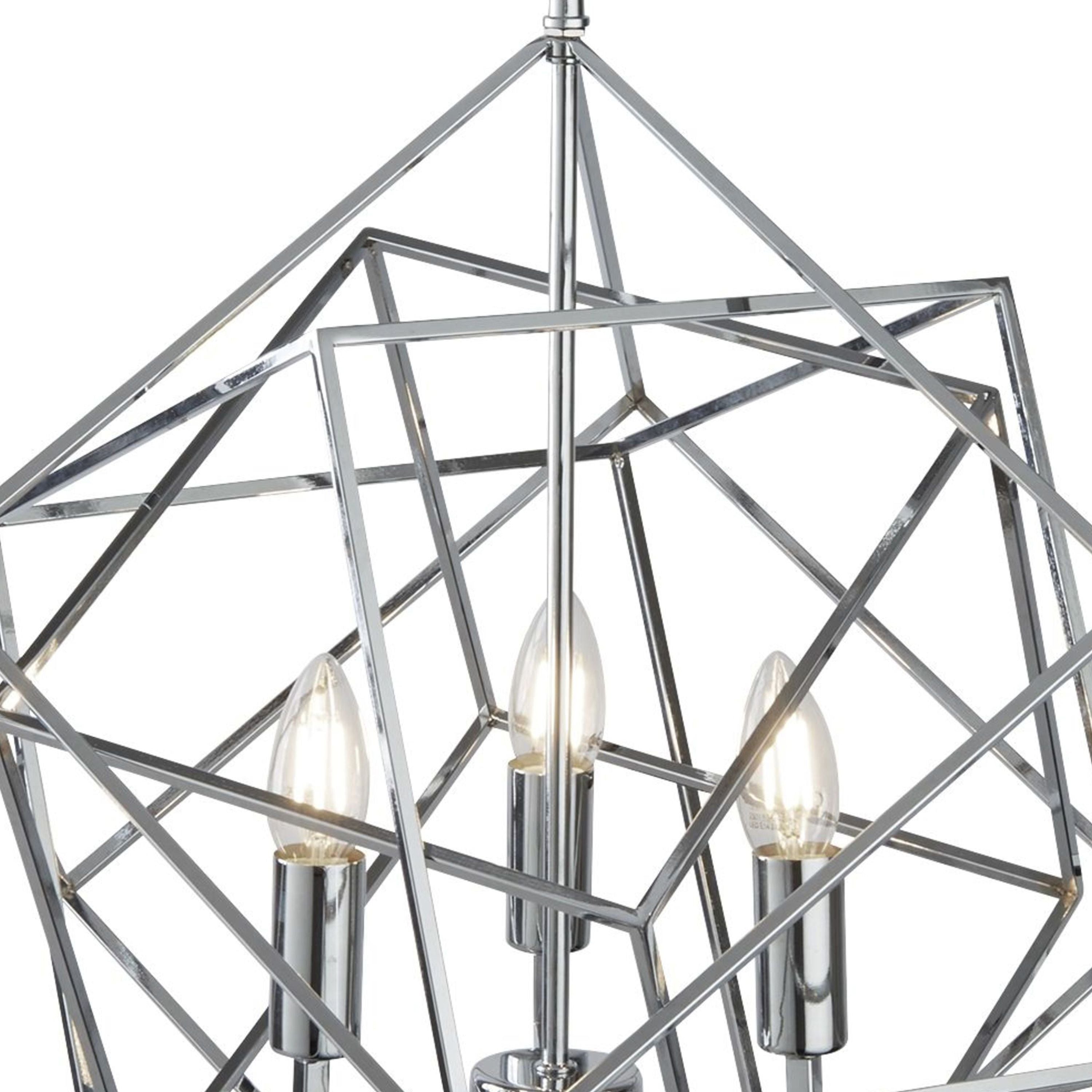 Close up from below of the Cube pendant's chrome frame and three lit candle bulbs