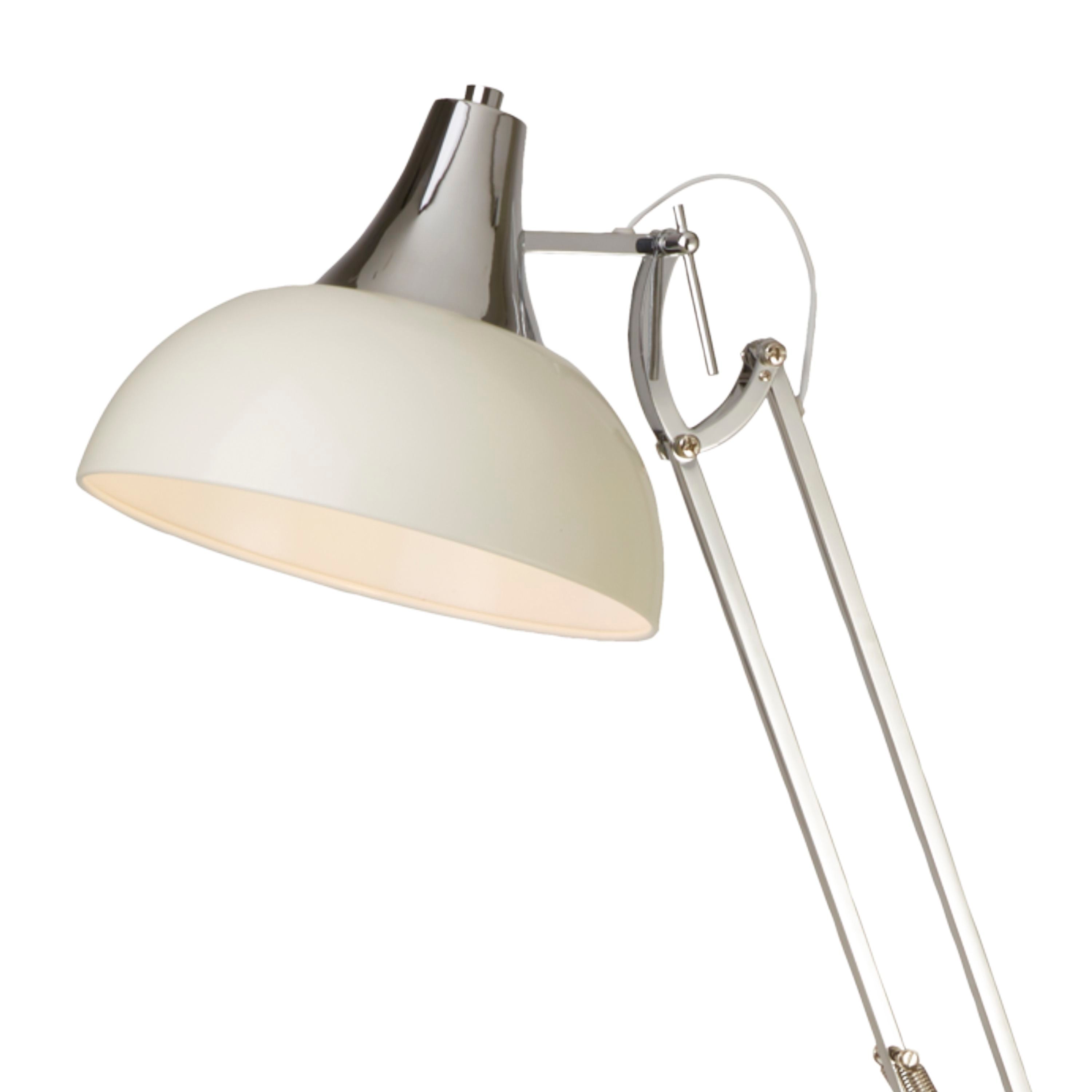 Close up of the cream dome shade and chrome swivel joint on the Goliath floor lamp