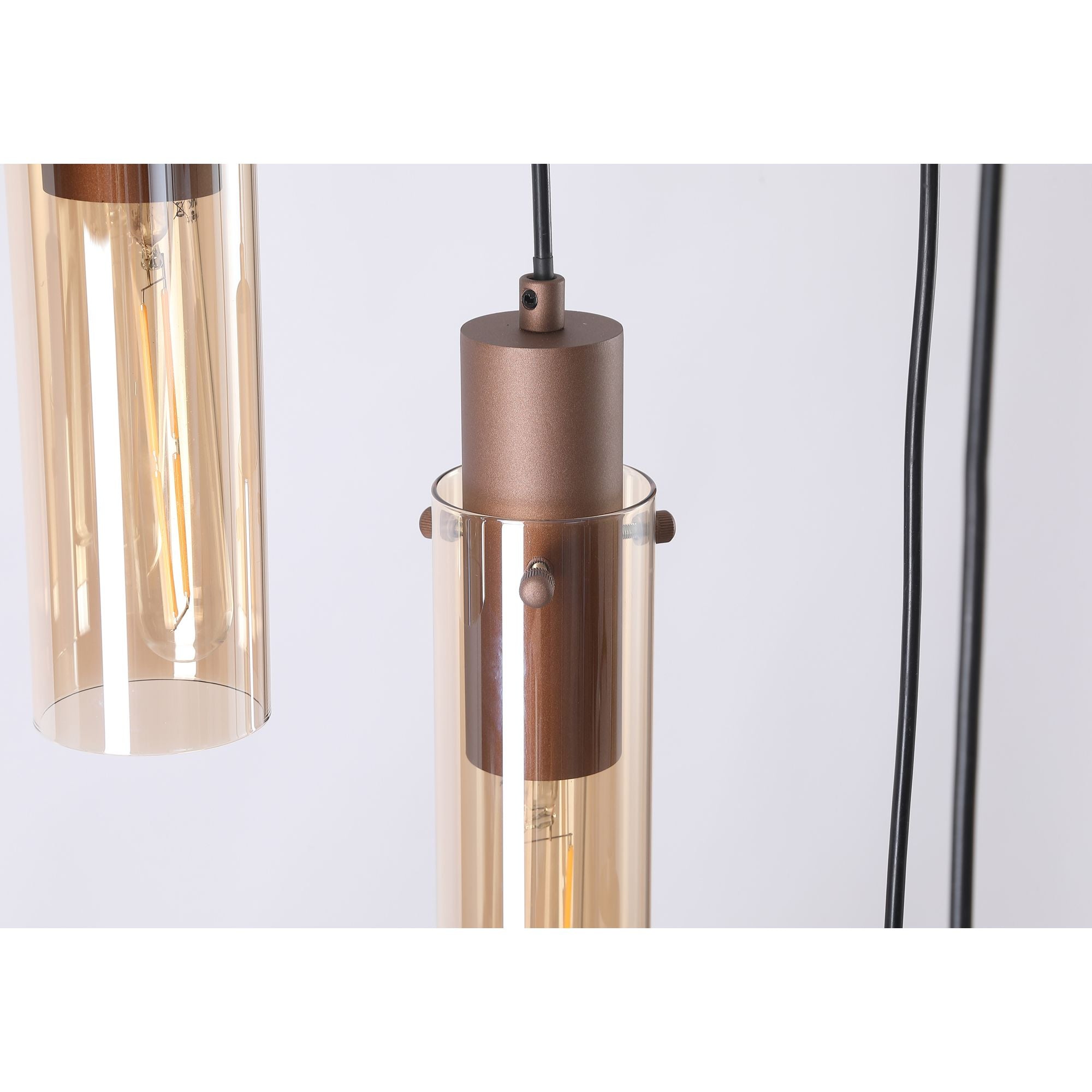 Close up of two amber glass shades and mocha metal fittings on the Searchlight Sweden II 8 light multi drop pendant