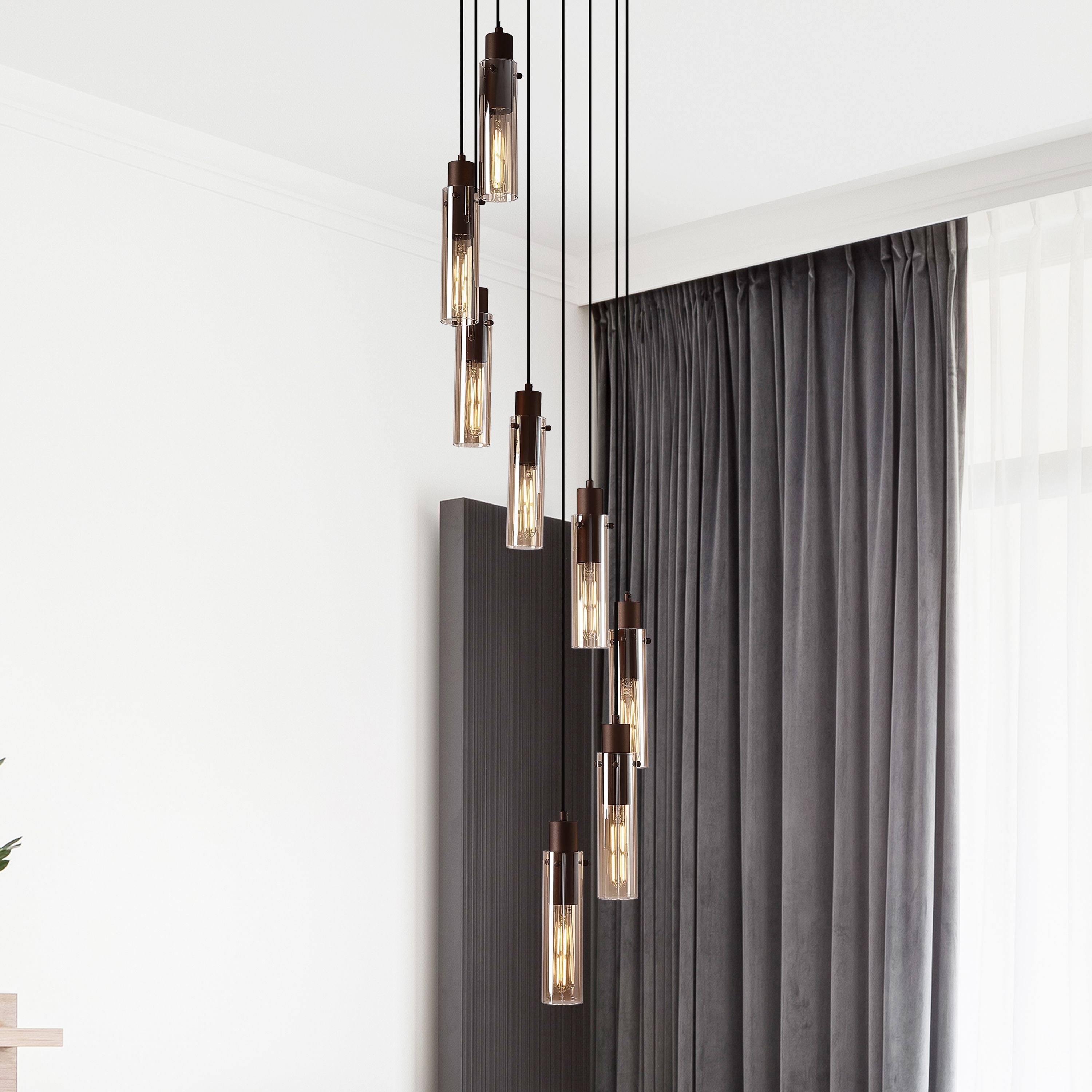 Searchlight Sweden II 8 light multi drop pendant styled in a stairwell beside grey curtains, lit