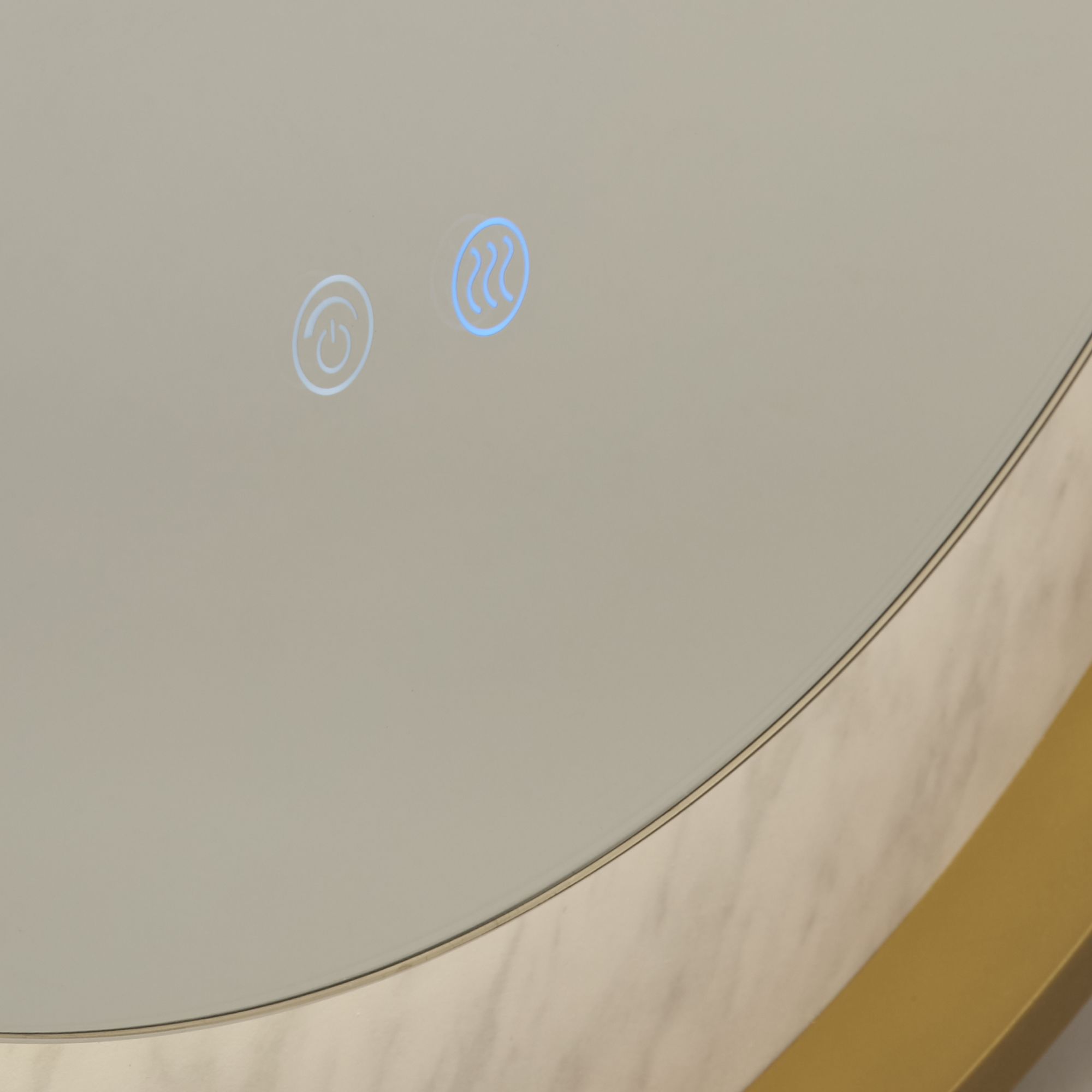 Close up of the touch power and demister control icons on the Searchlight Luxo mirror, with the gold frame and marble effect ring visible in the corner
