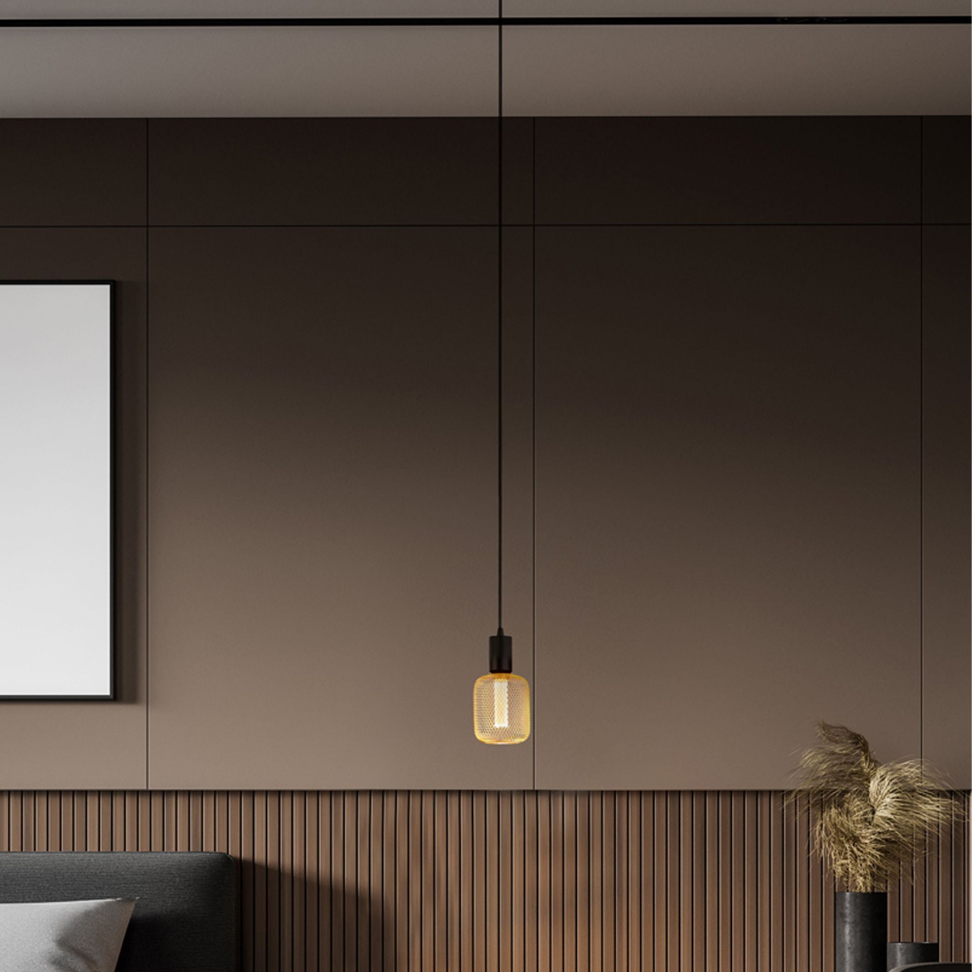 Searchlight Squiggle black pendant styled in a dark panelled room, fitted with a lit cage style decorative bulb beside a framed picture and a potted plant