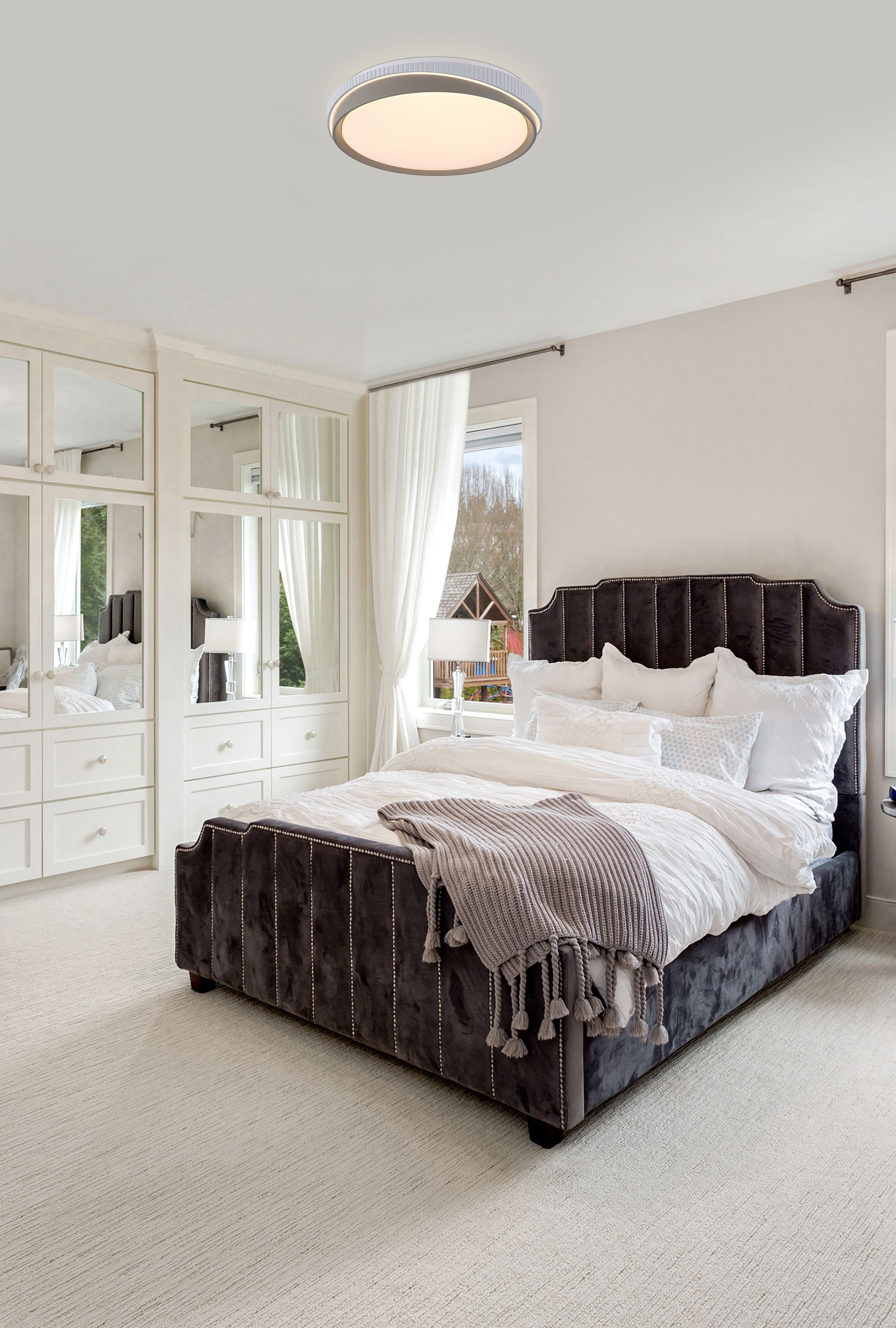 Searchlight Galactic Round LED flush ceiling light 2 Tone in white and gold, styled on the ceiling of a bedroom with a dark upholstered bed