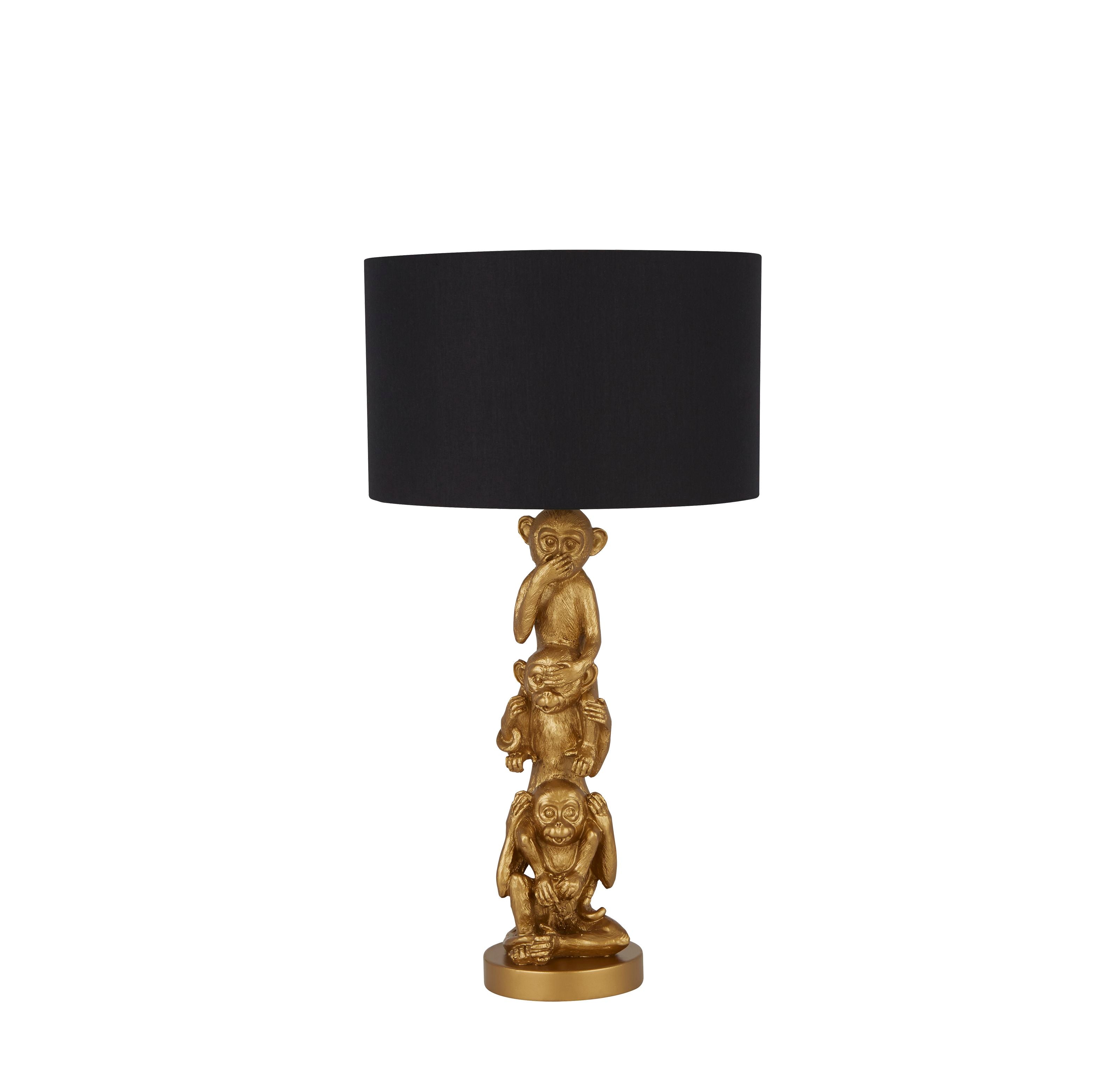 Searchlight 3 Wise Monkeys table lamp in gold resin with a black fabric drum shade, front view on a white background
