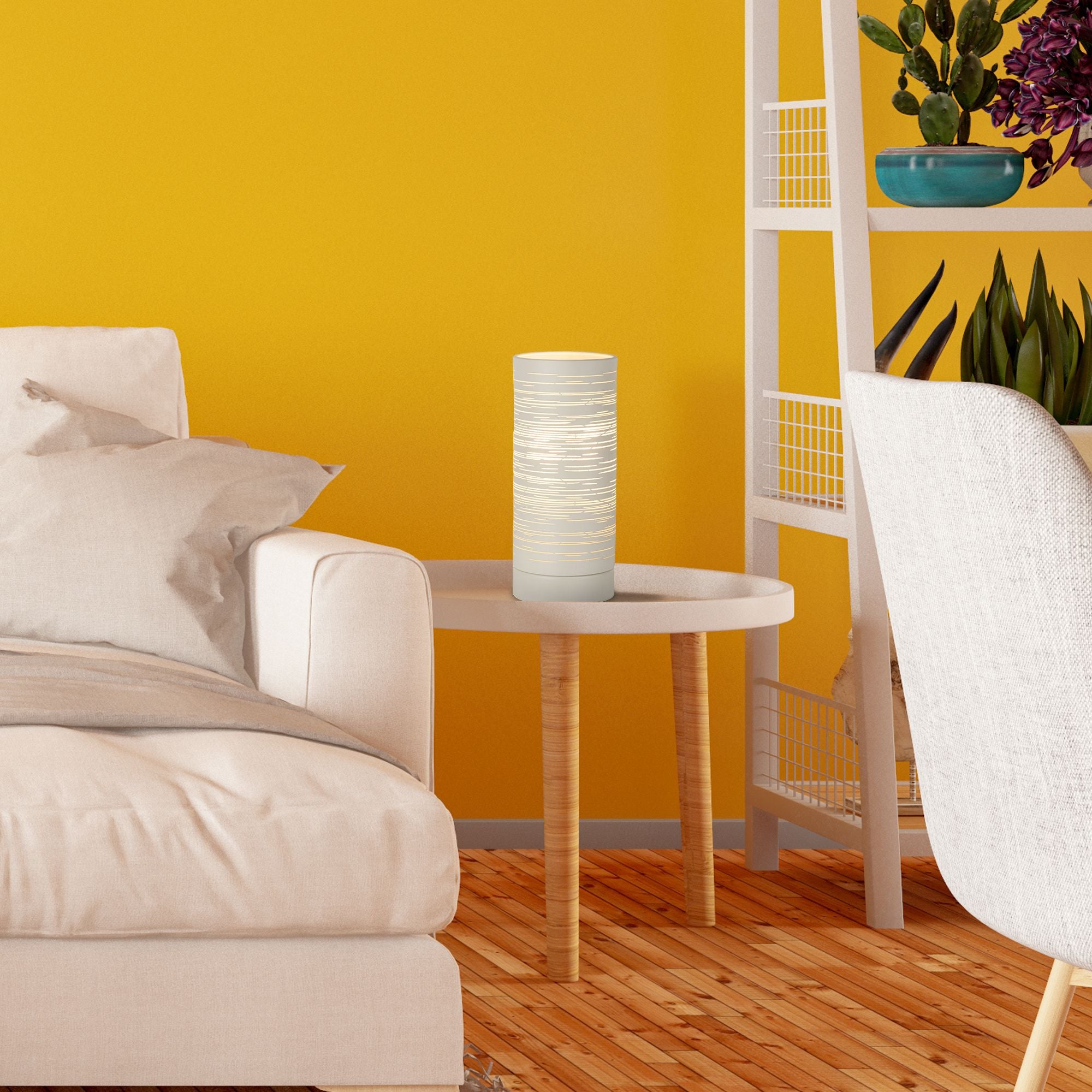 Savvy table lamp switched on and glowing on a side table in a living room with a mustard yellow wall and houseplants