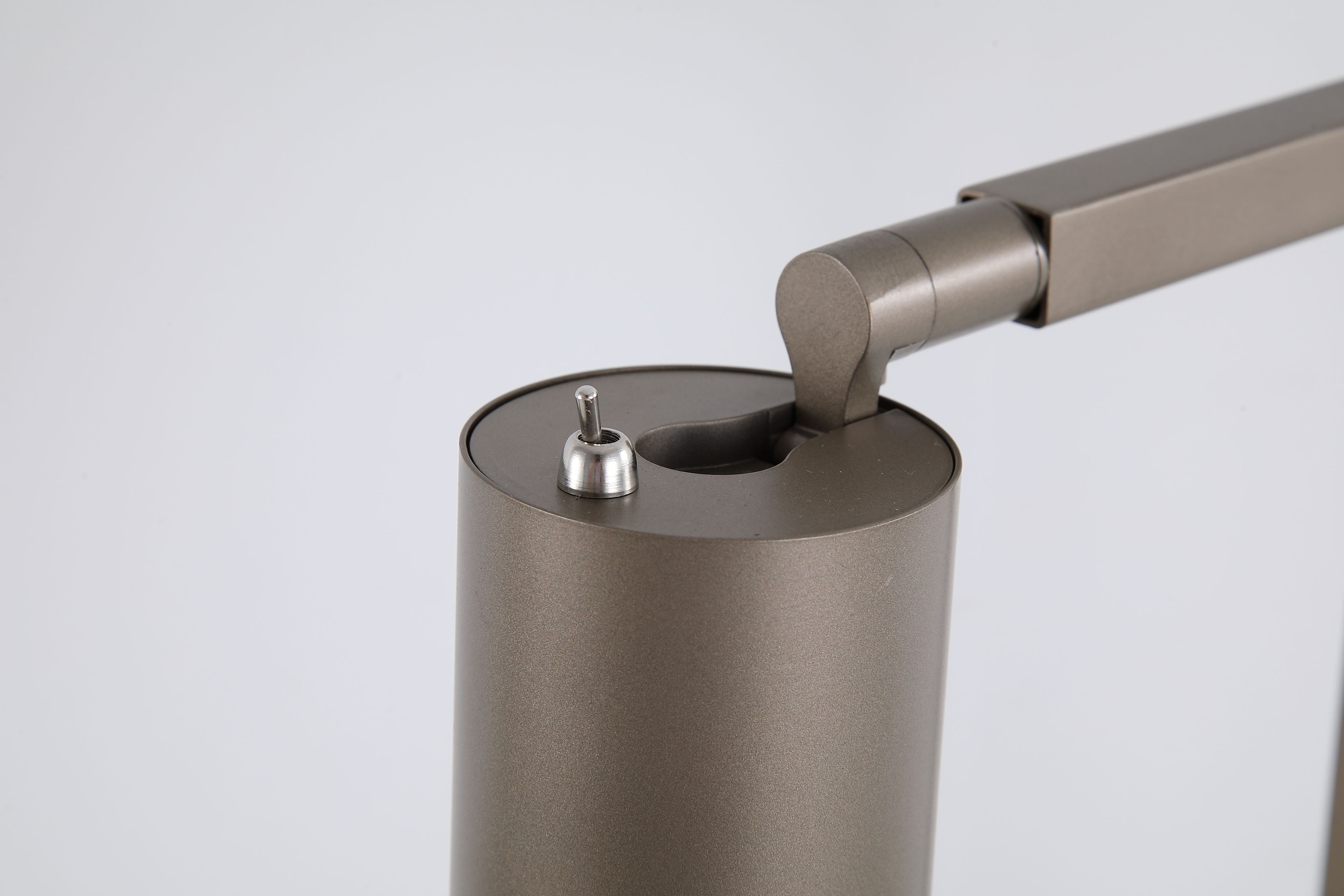 Close up of the Office table lamp's cylindrical shade and the joint that lets it tilt