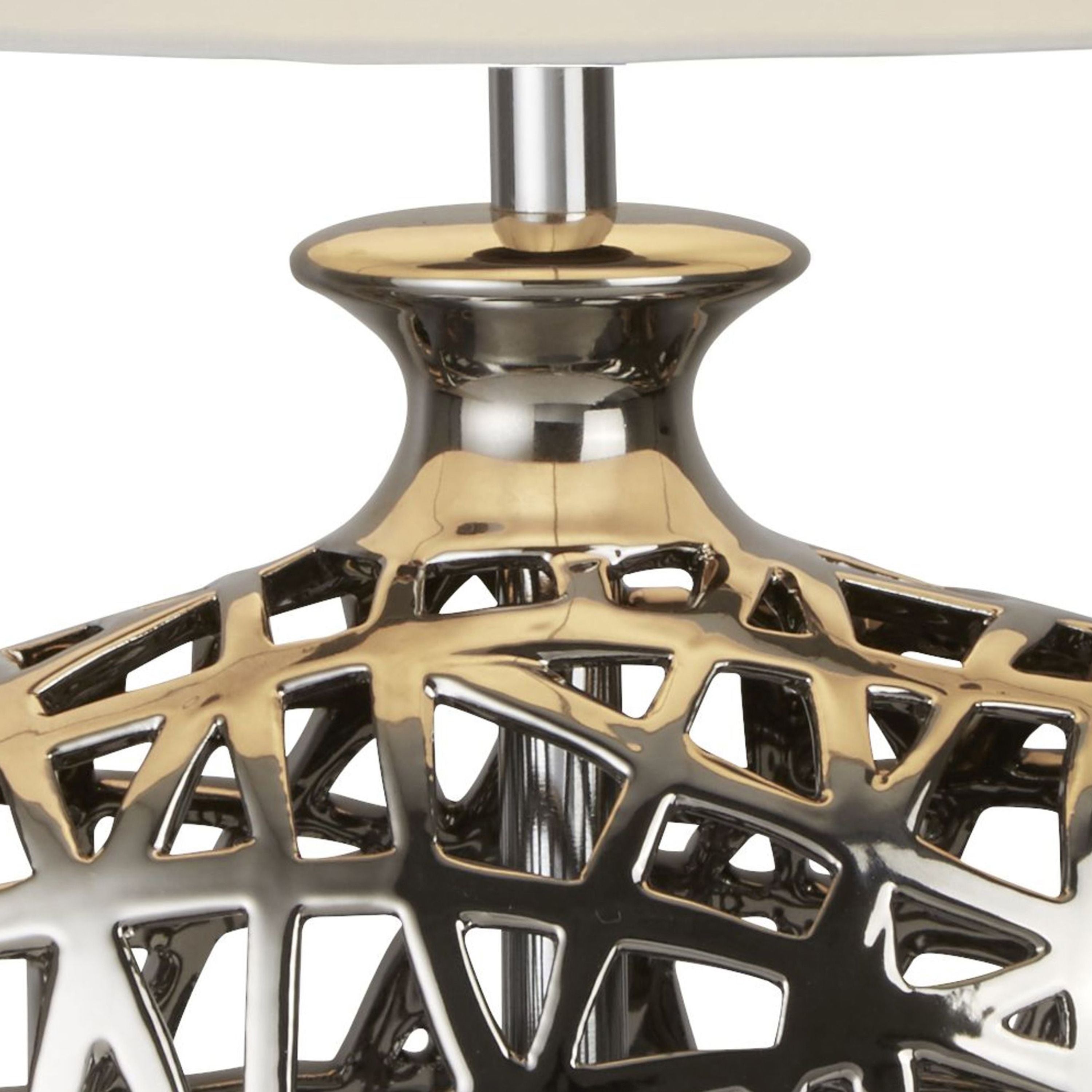Close up of the large Network table lamp's neck and cut out ceramic base, showing a warm gold tinted chrome effect glaze in detail