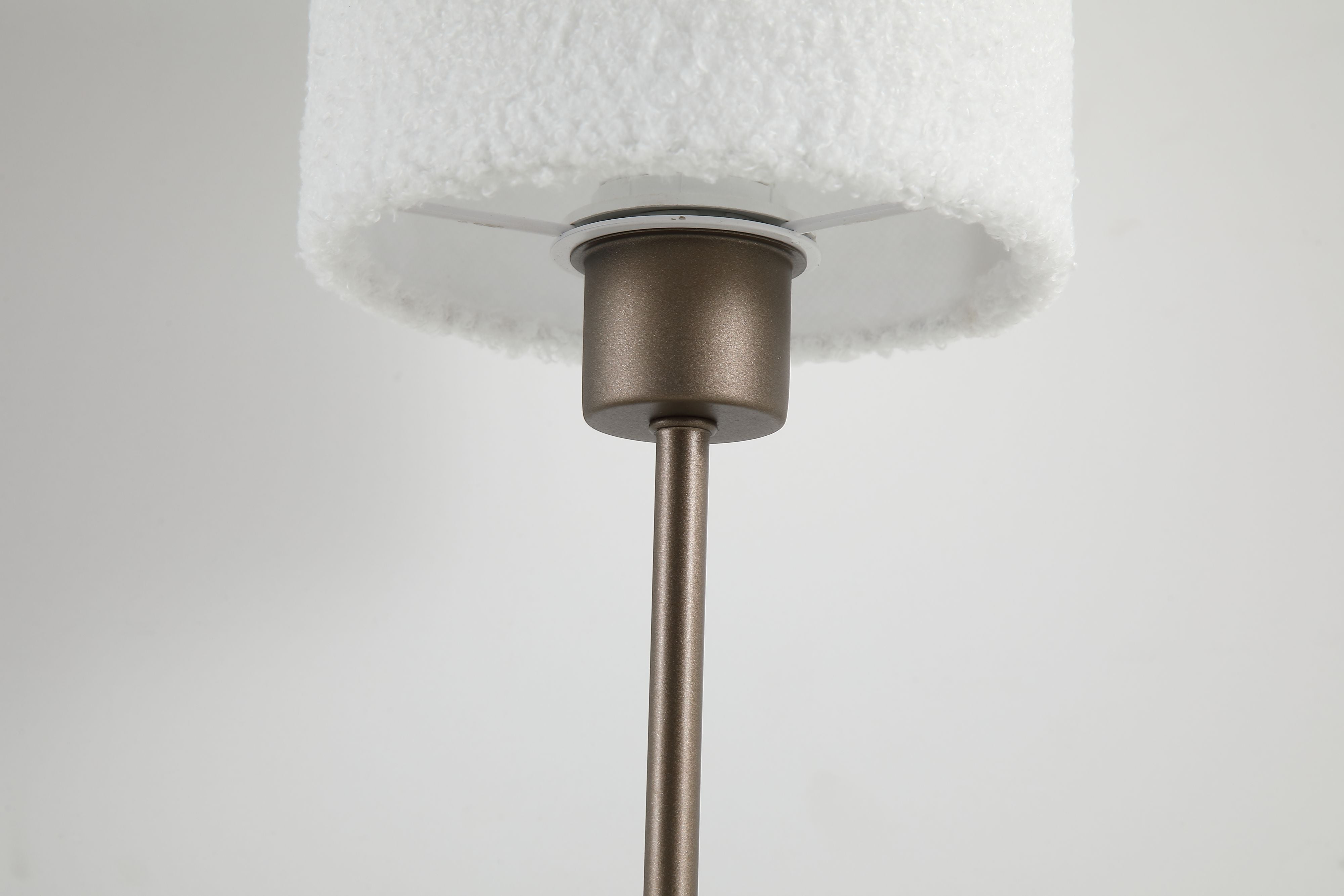 Close up of the Searchlight Chelsea lamp showing the latte metal fitting where the plush shade meets the stem