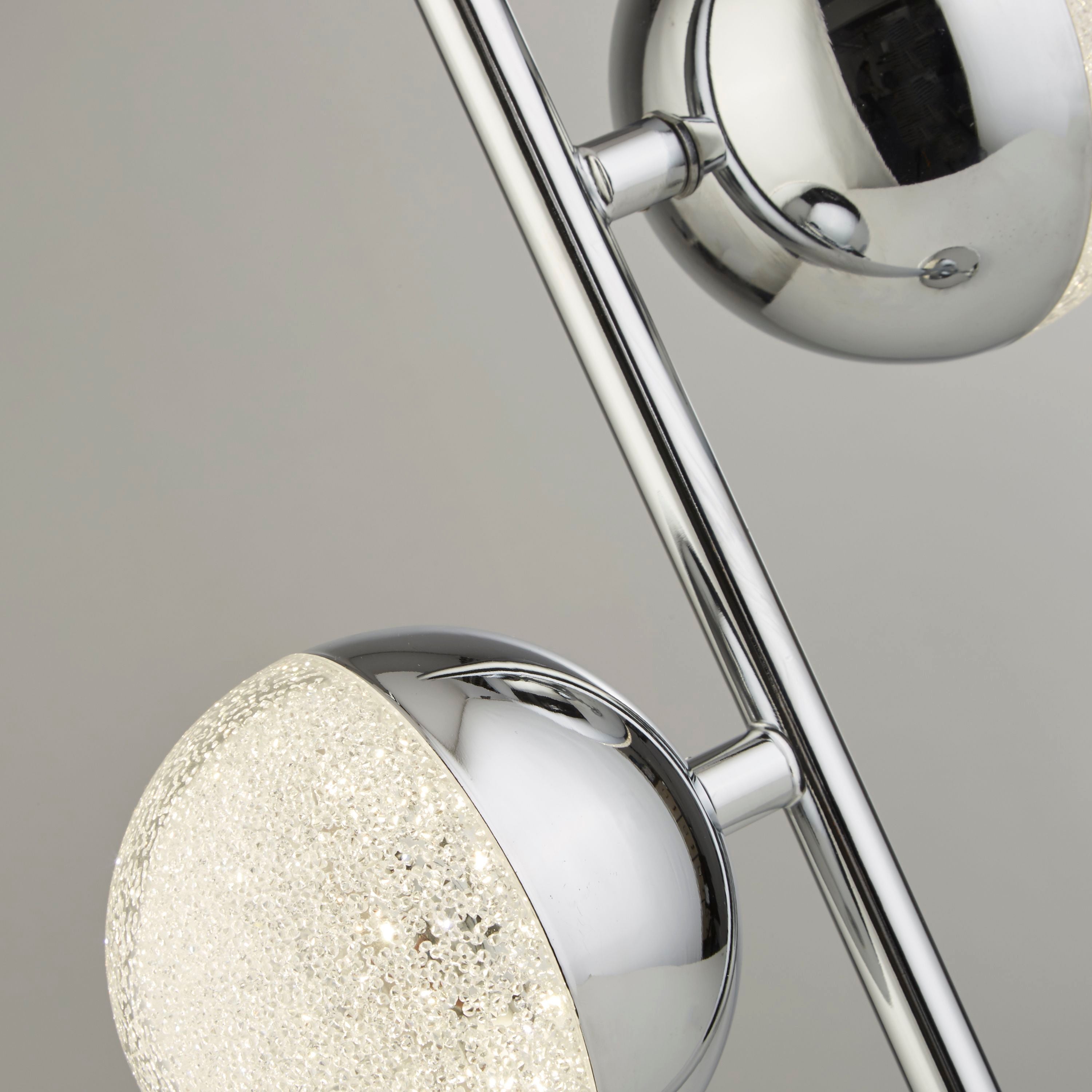 Close up of the Marbles lamp's chrome ball shade showing the sparkling crystal sand glass texture