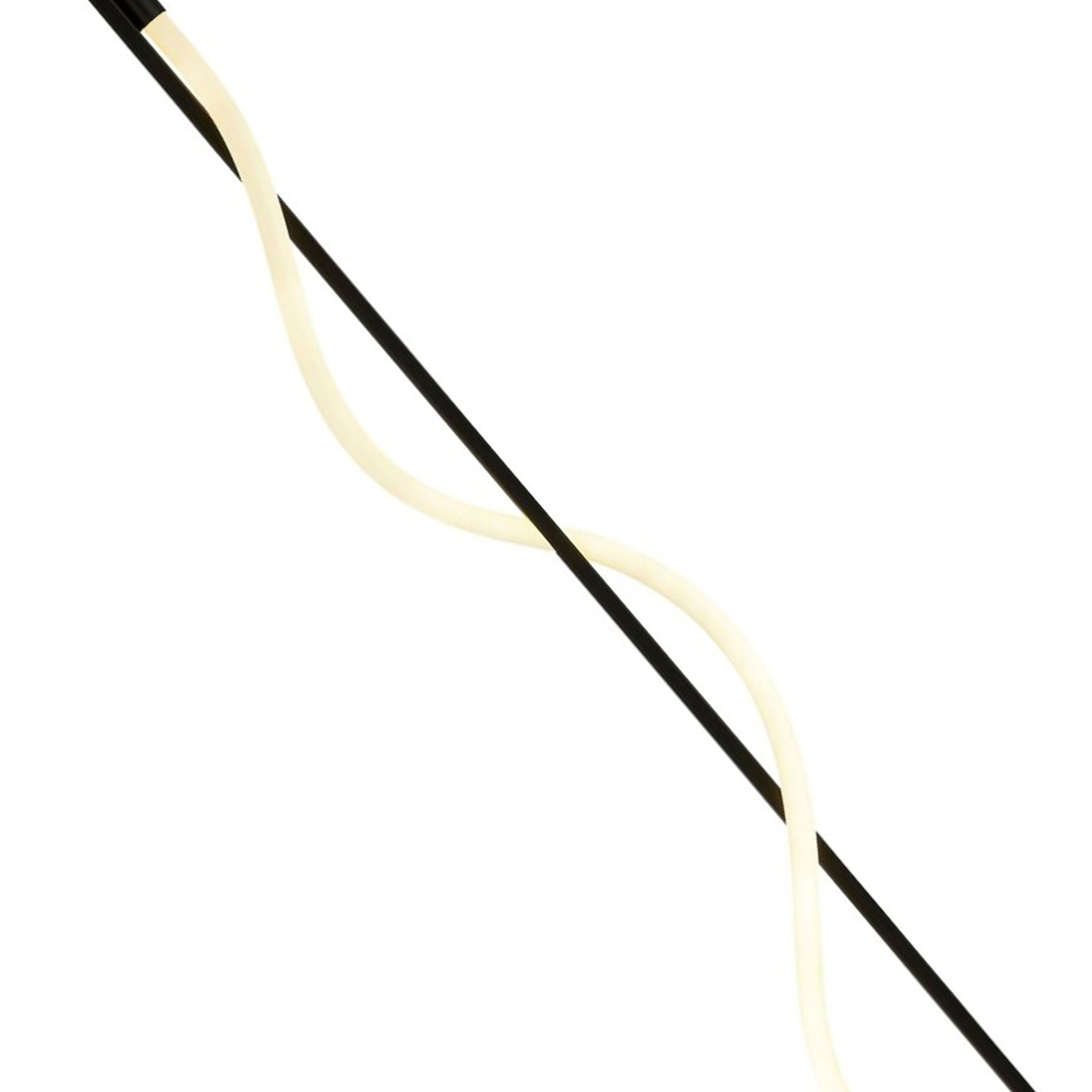 Close up of the Serpent floor lamp's spiral opal tube crossing the matt black rod, showing the silicone diffuser detail