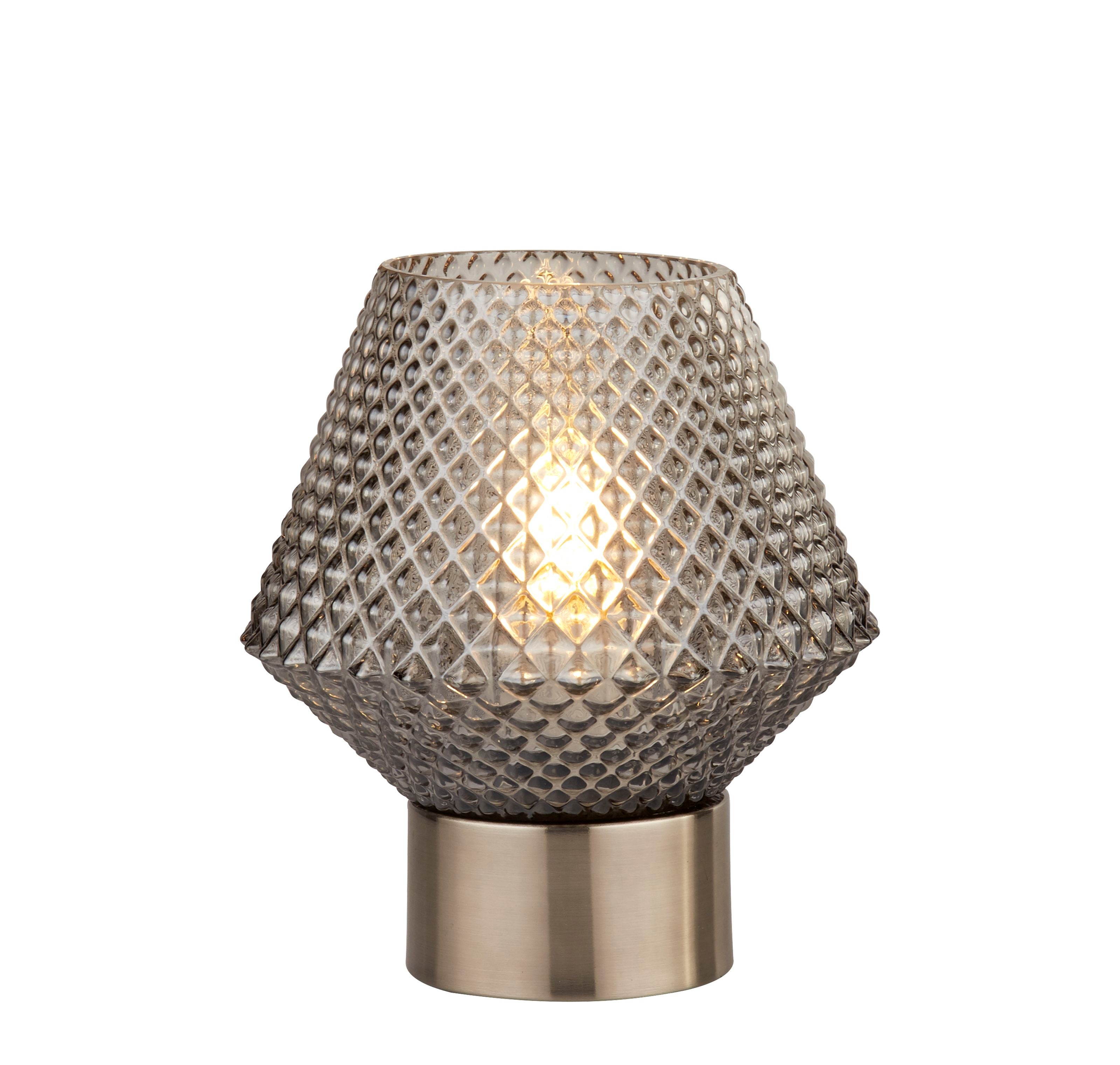 Searchlight Avia table lamp with a diamond textured smoked glass shade and satin chrome base, lit, studio shot on a white background