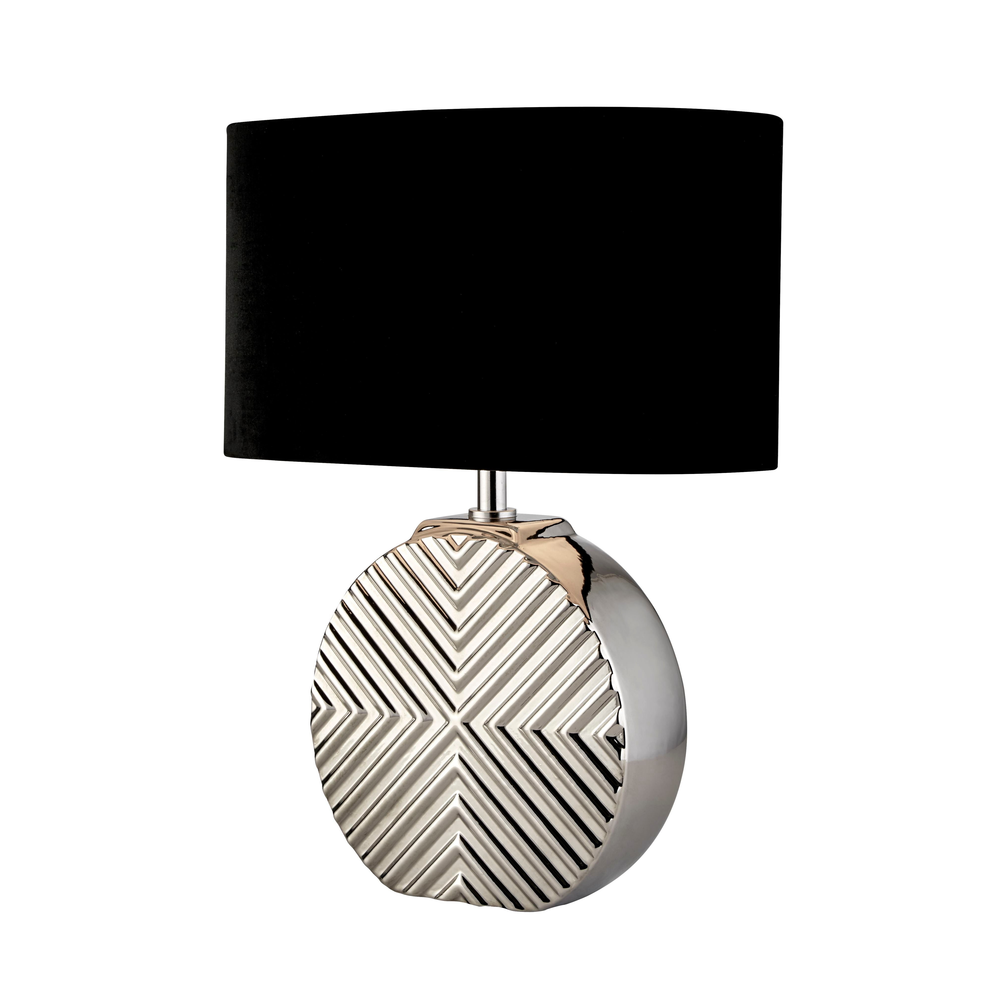 Searchlight Regen table lamp with chrome ceramic chevron textured base and black oval fabric shade, angled studio shot on a white background
