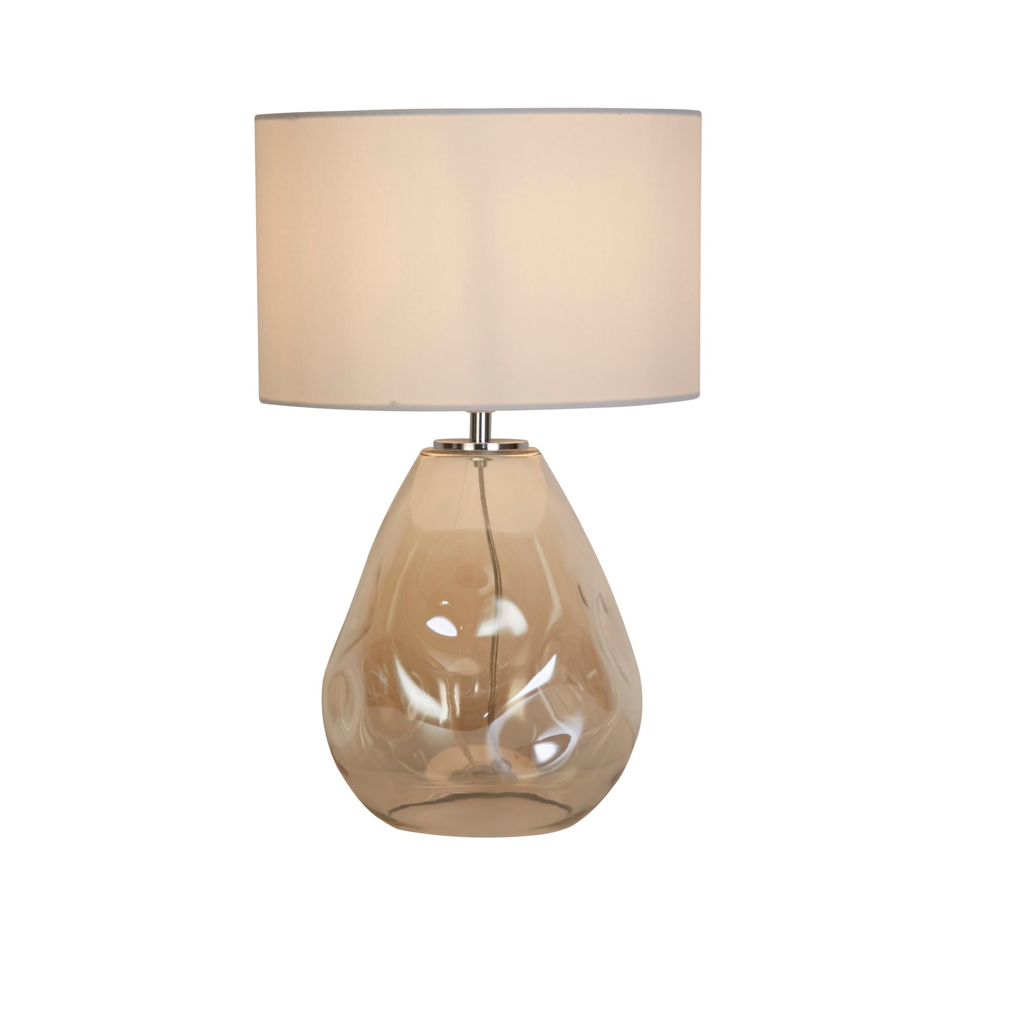 Searchlight Devon table lamp in champagne, with a dimpled amber tinted glass teardrop base and an off white linen drum shade, studio shot on a white background