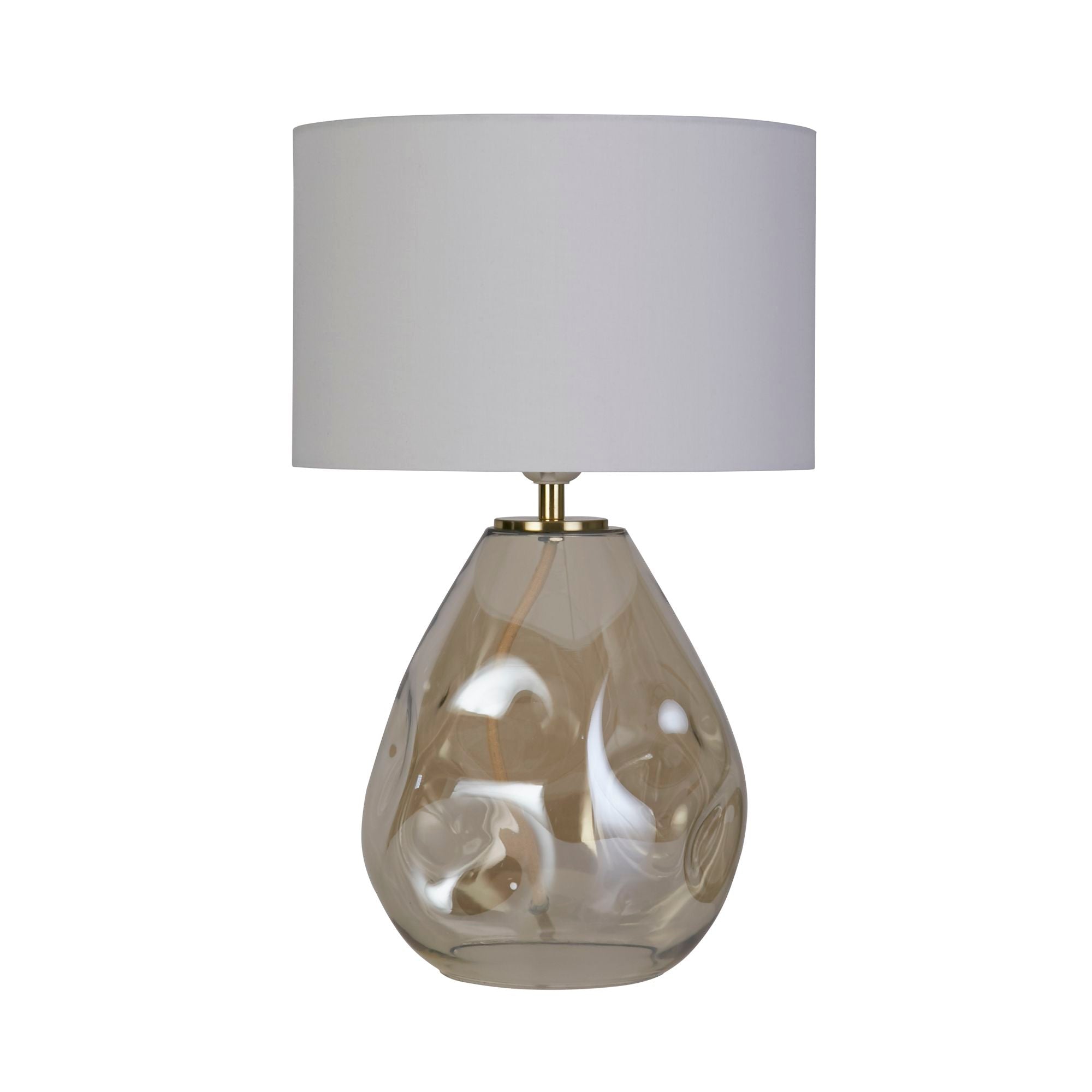 Searchlight Devon table lamp in champagne shown from a slightly different angle, dimpled amber tinted glass base with an off white linen drum shade