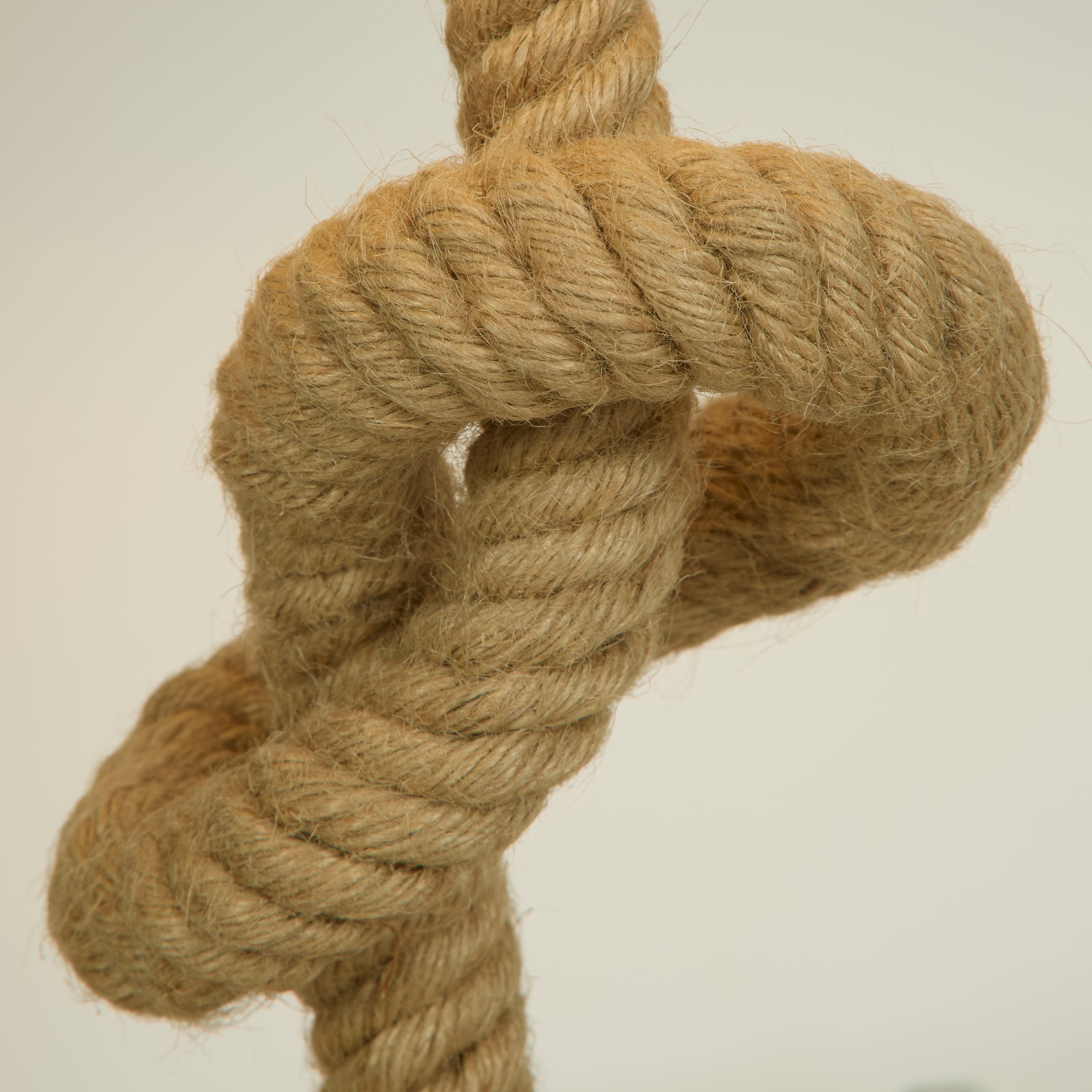 Close up of the knotted rope base on the Searchlight Rope table lamp, showing the natural rope texture
