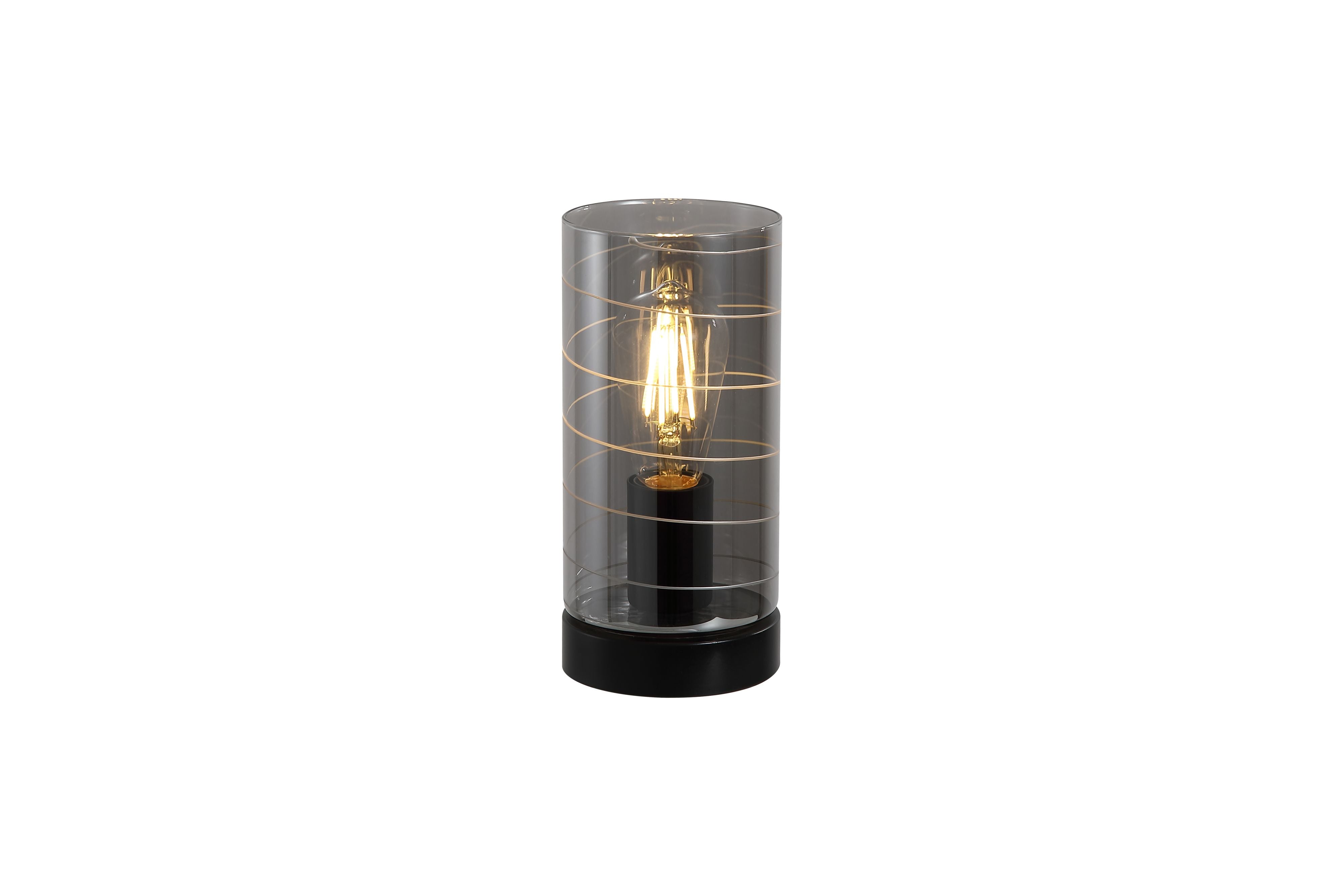 Searchlight Broughton table lamp in smoked glass with a black base, lit showing the exposed filament style bulb through the spiral line pattern