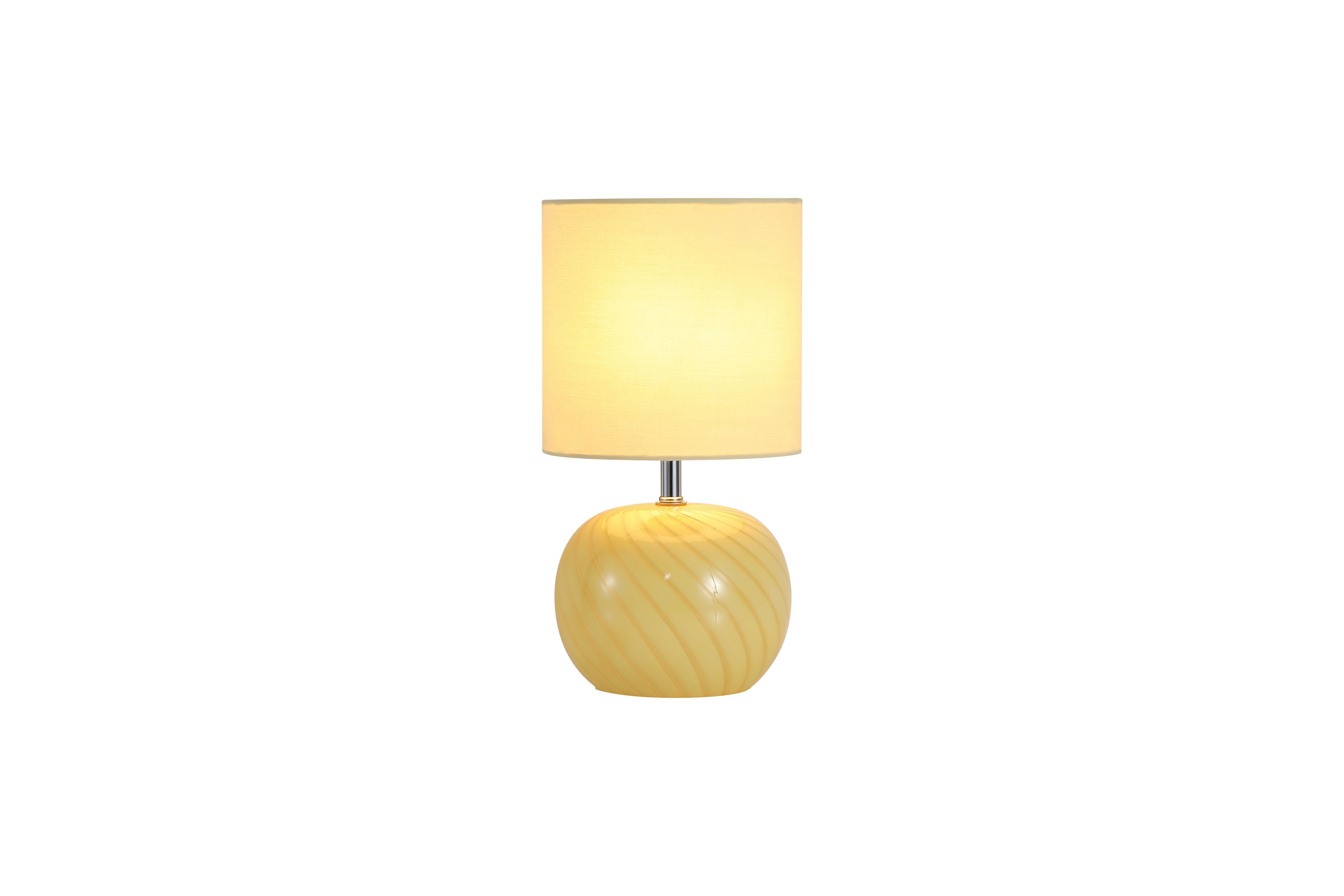 Searchlight Fete table lamp with yellow swirled glass base and yellow linen drum shade, studio shot on white background
